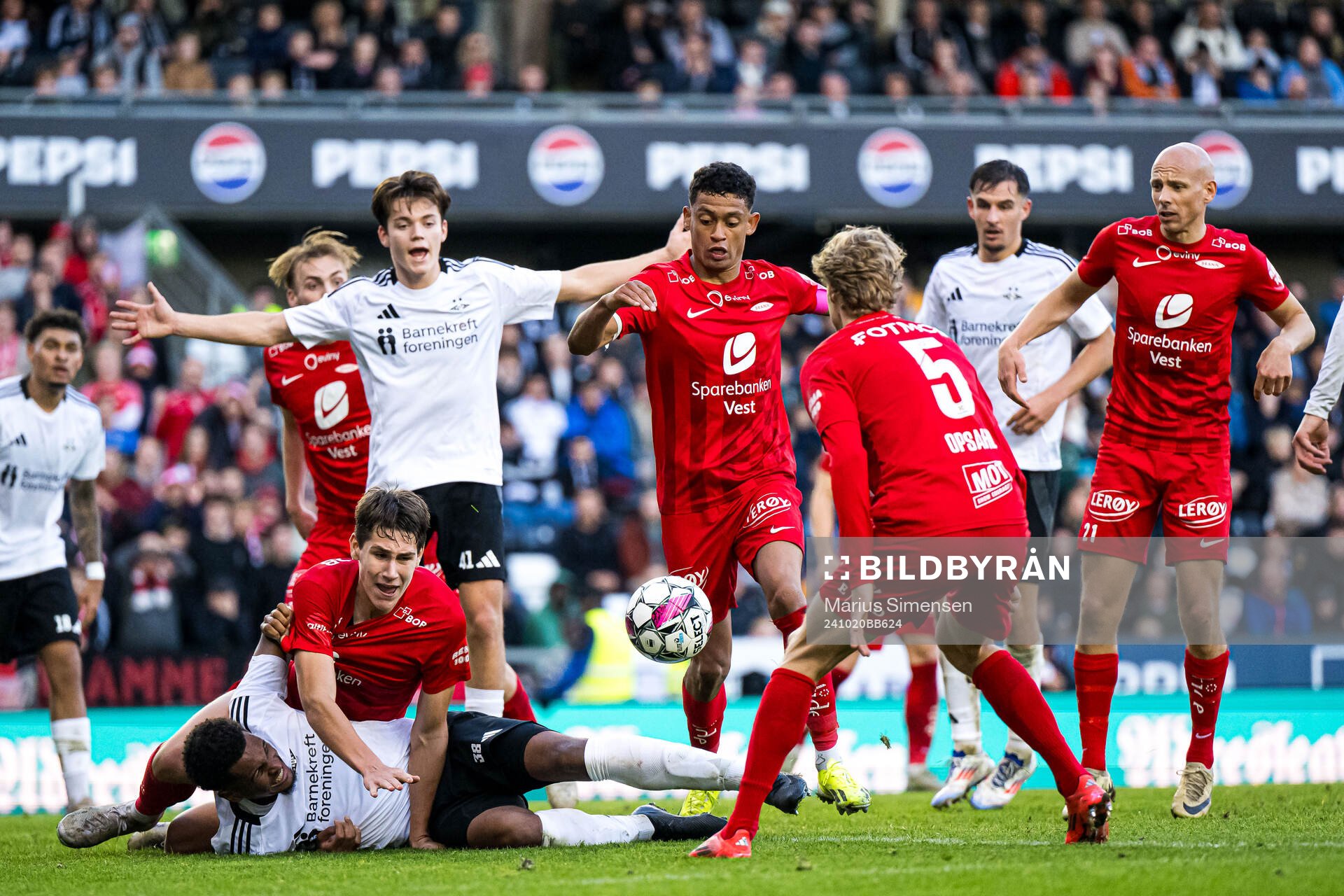 Mikkel Konradsen Ceide of Rosenborg and Eivind Helland of Brann during the Eliteserien match between Rosenborg and Brann on October 20, 2024 in Trondheim. 