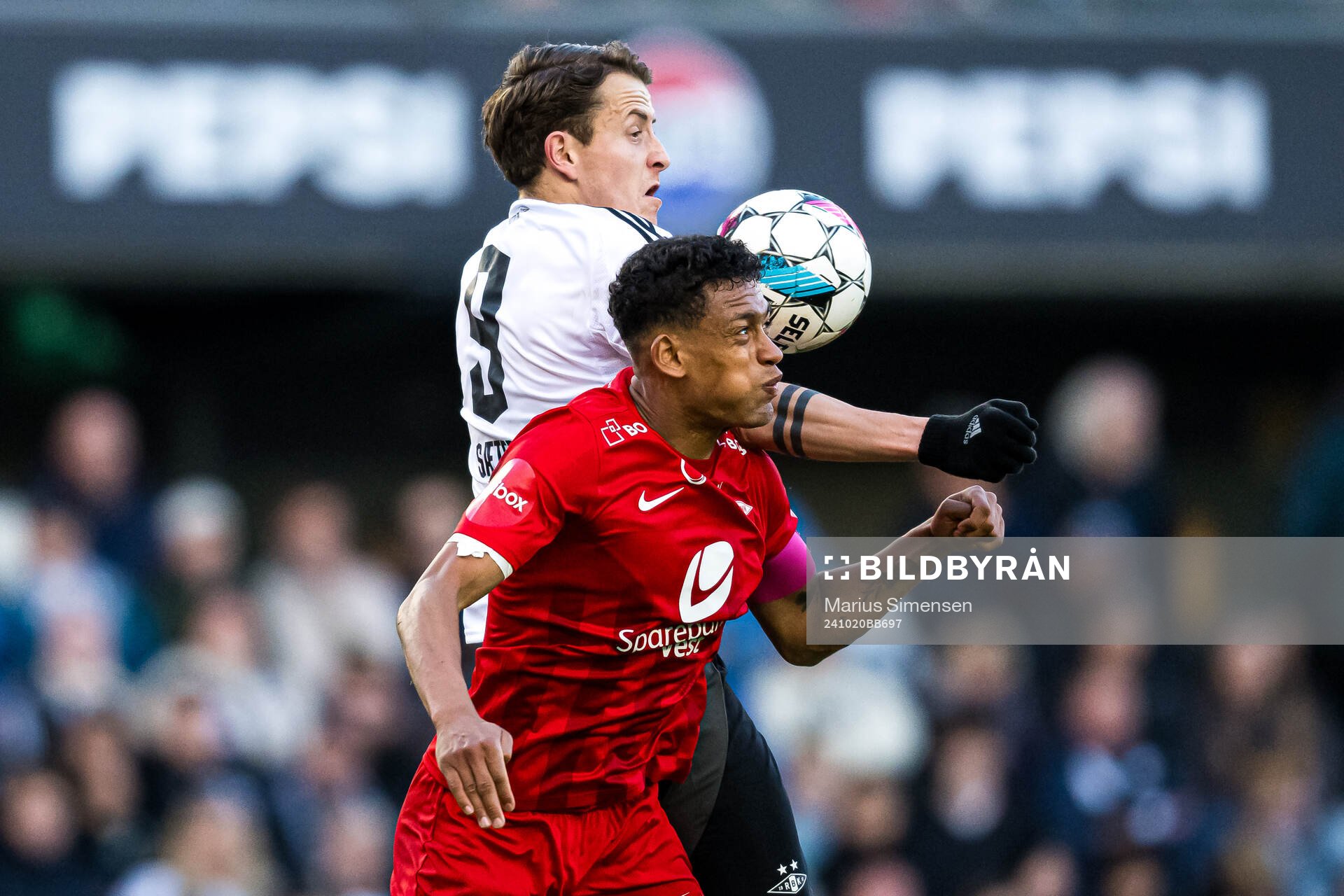Ole Sæter of Rosenborg and Japhet Sery Larsen of Brann