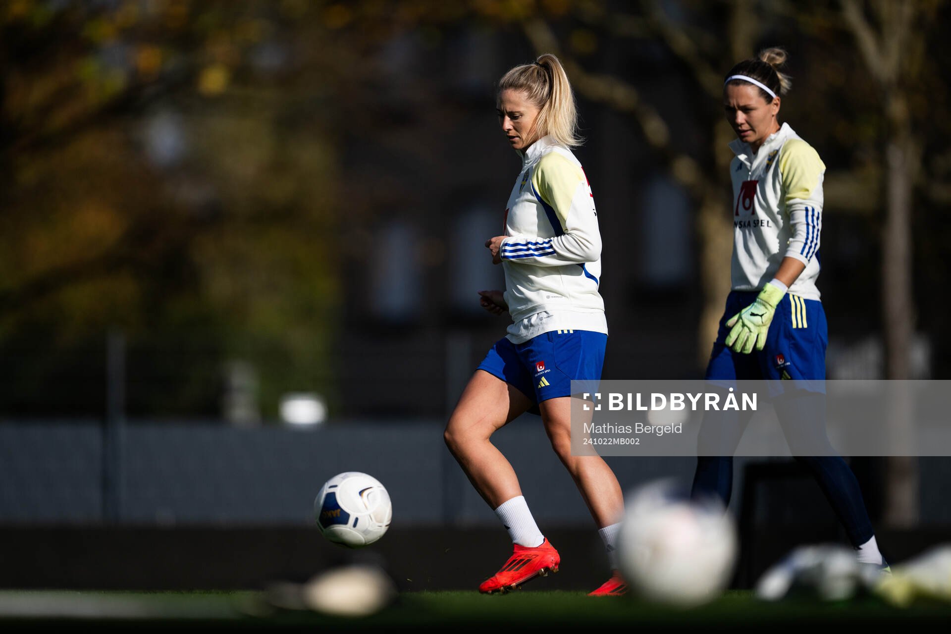 Rebecka Blomqvist and goalkeeper Jennifer Falk of the