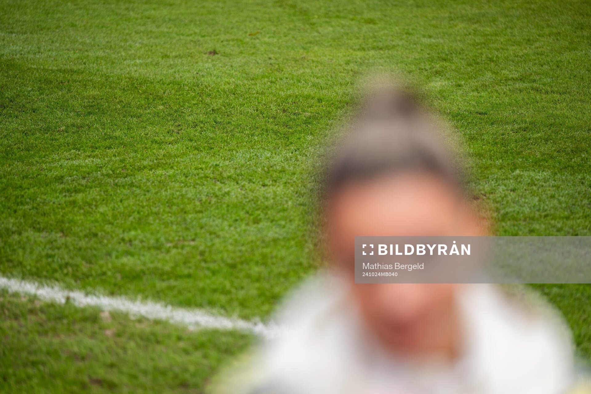 The grass of the pitch is seen behind Johanna Rytting
