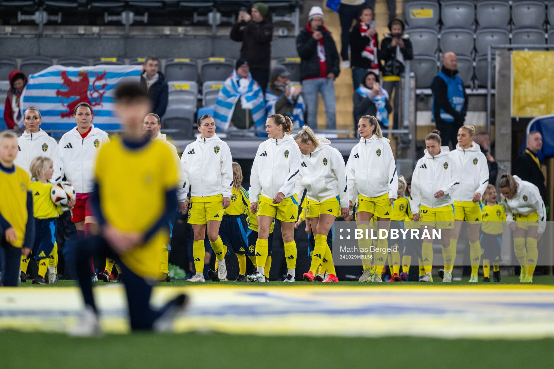 Hanna Wijk and Magdalena Eriksson of Sweden enter the pitch