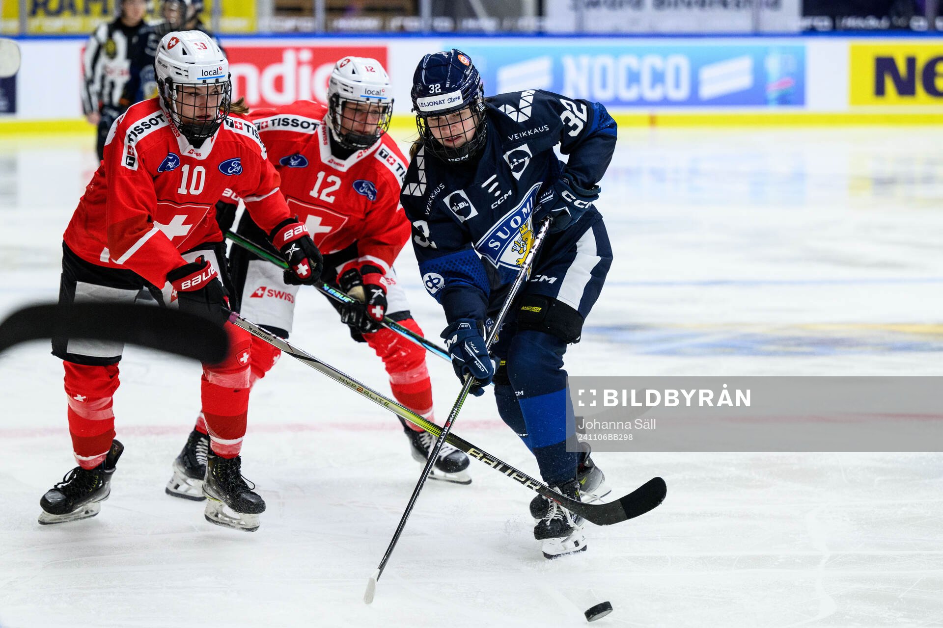 Janine Hauser and Lisa Ruedi of Switzerland and Emilia Vesa