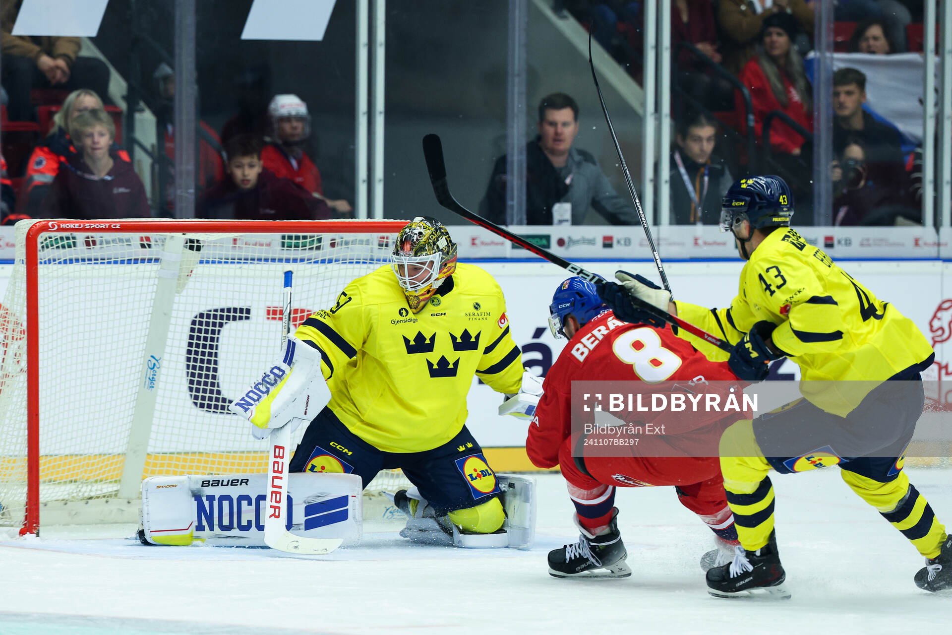 Goaltender Erik Källgren and Filip Berglund of Sweden