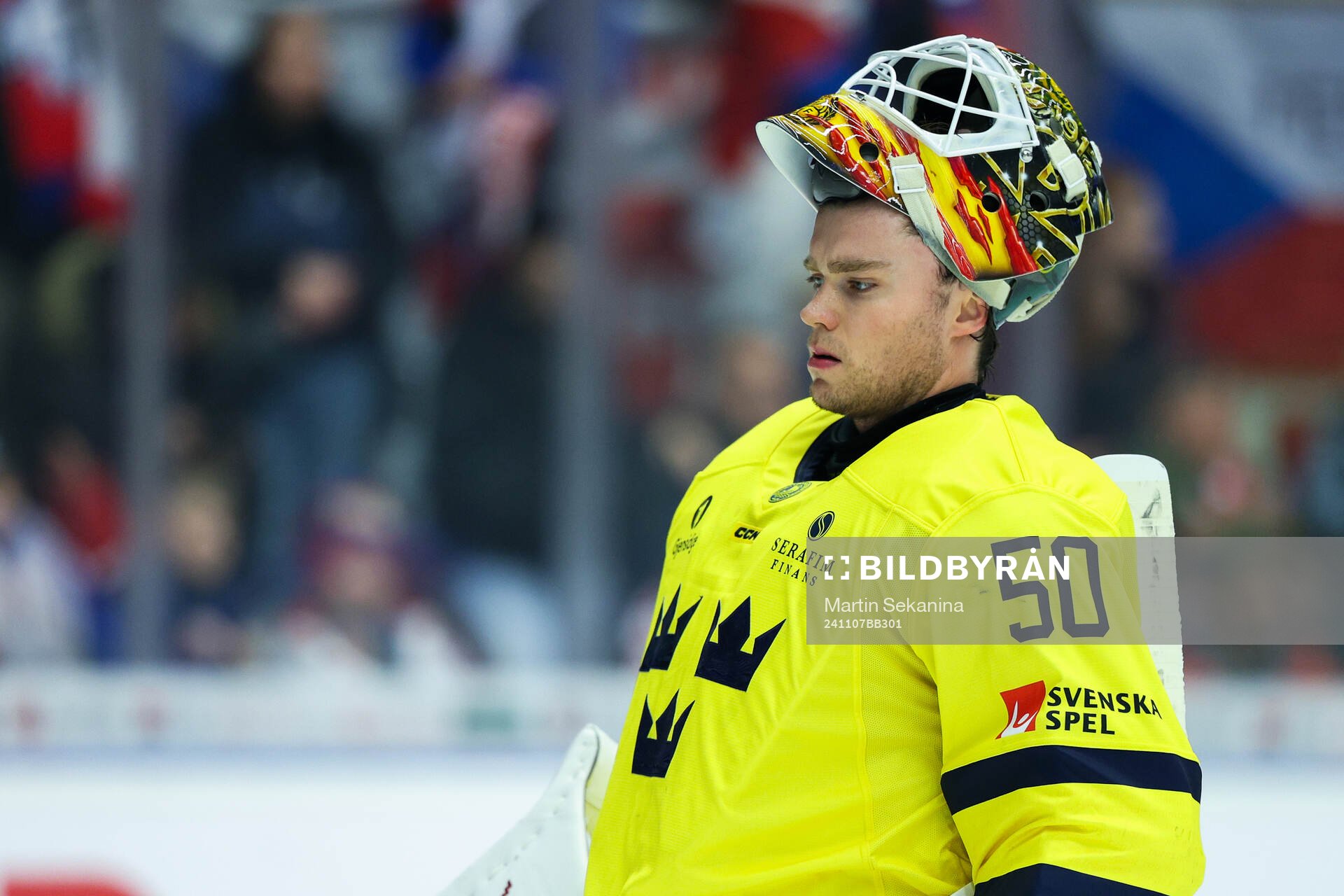 Goaltender Erik Källgren of Sweden looks dejected