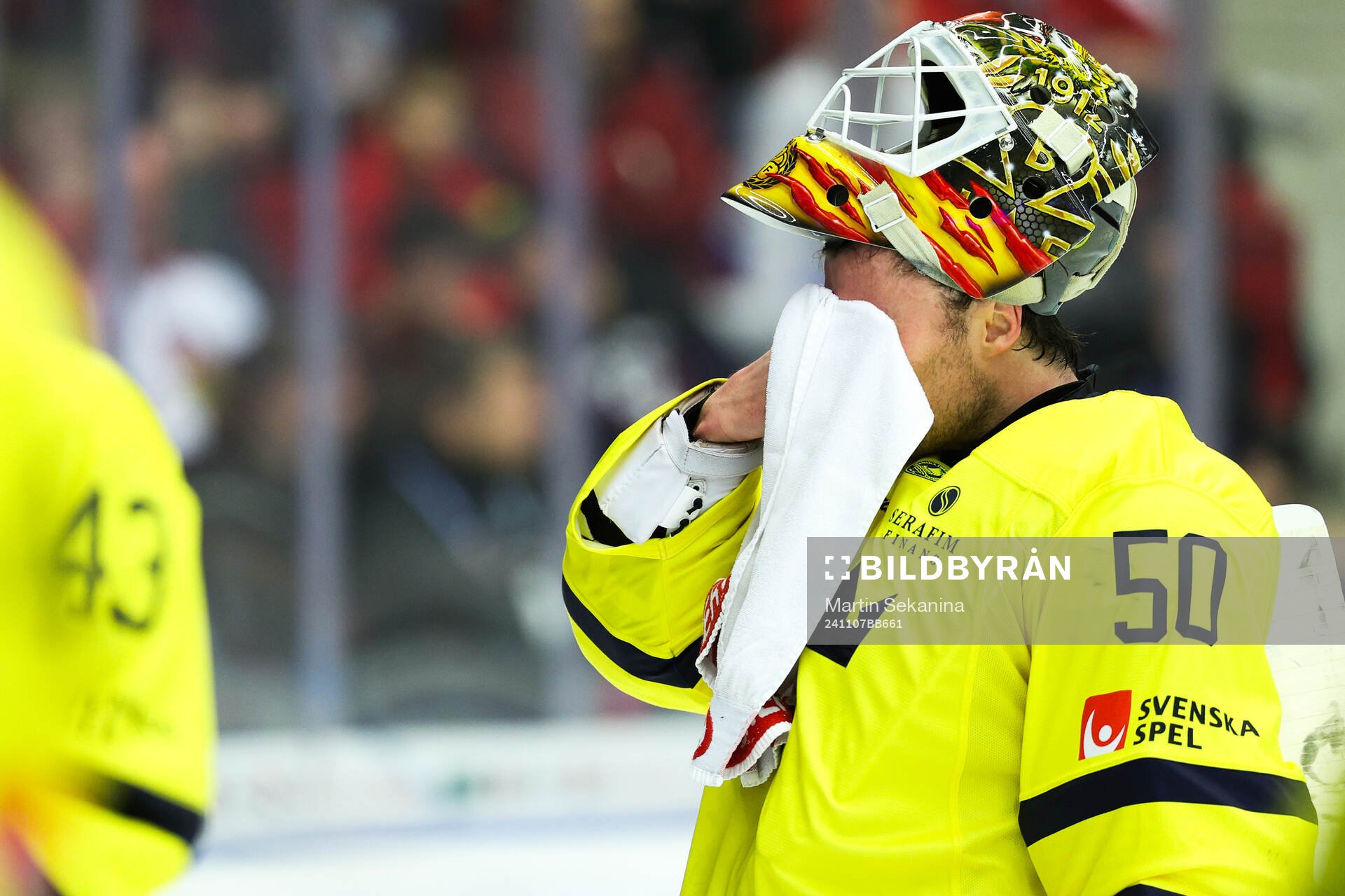 Goaltender Erik Källgren of Sweden looks dejected