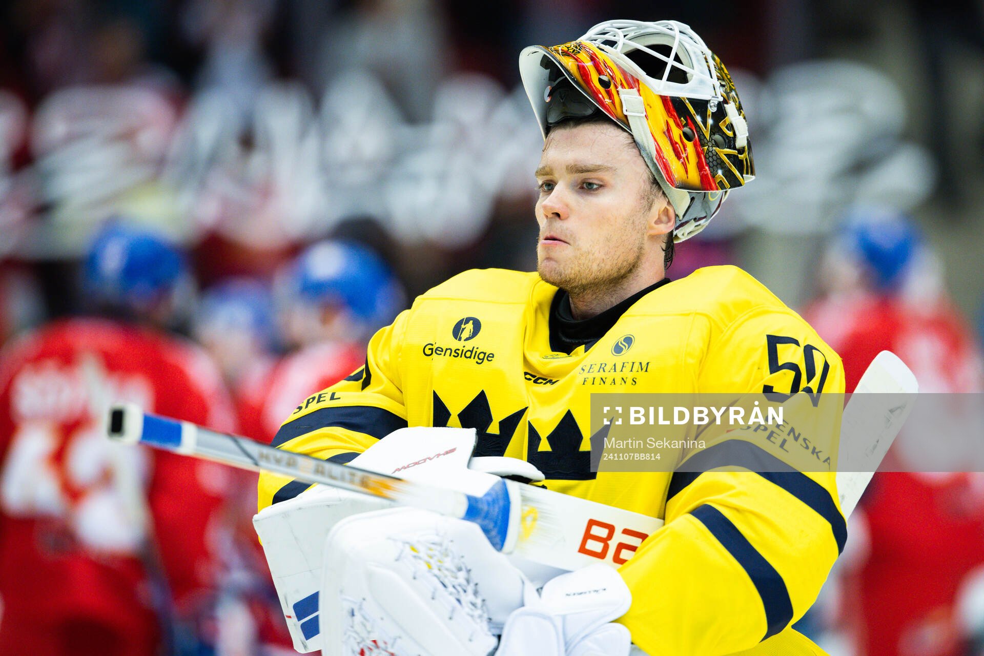 Goaltender Erik Källgren of Sweden looks dejected