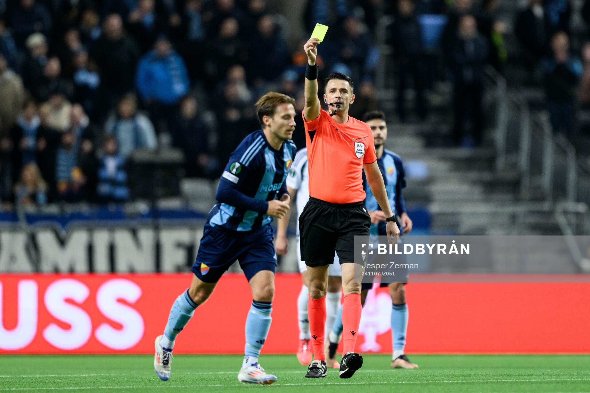 Daniel Stensson of Djurgården receives a yellow card from
