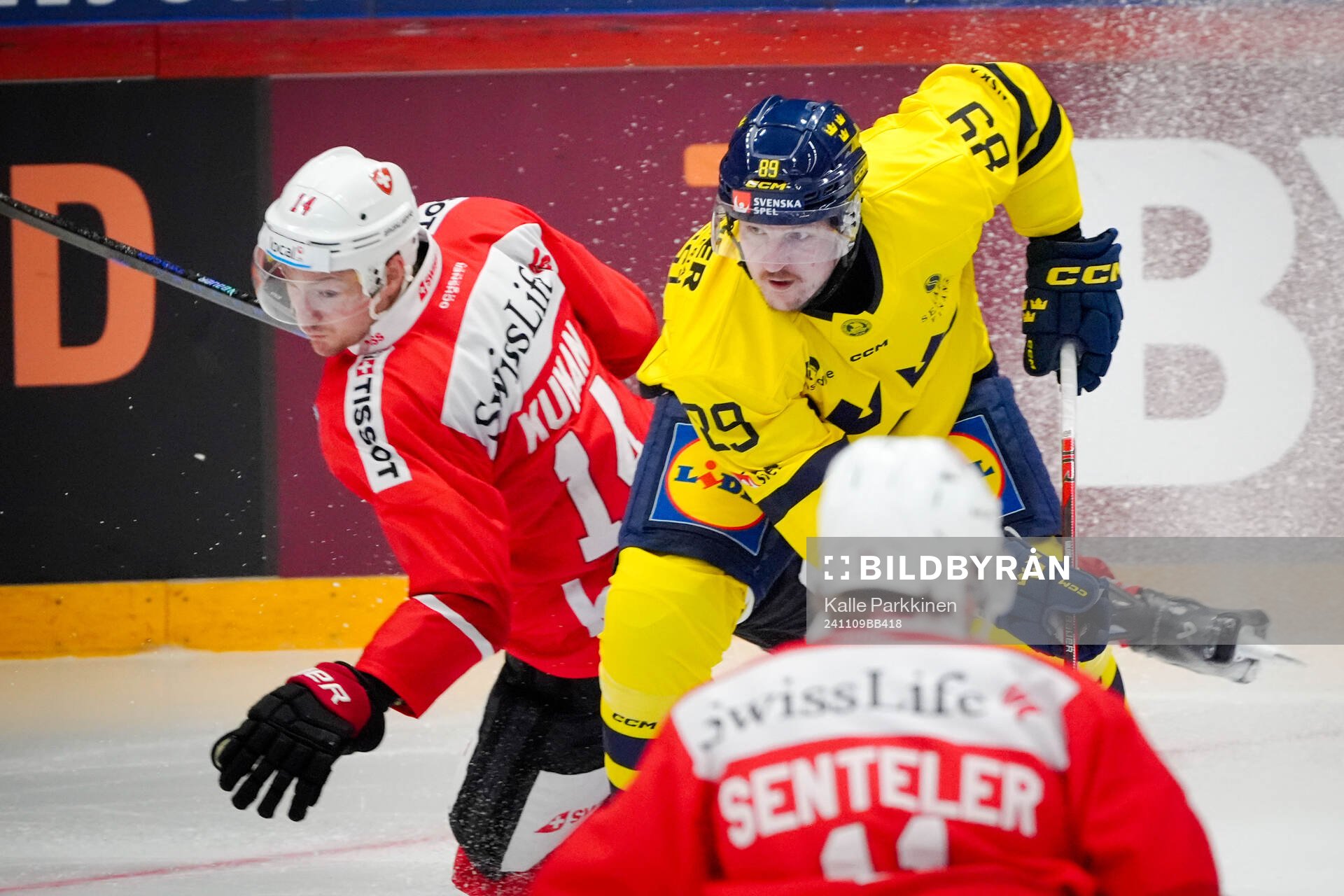 Dean Kukan of Switzerland and Patrik Karlkvist of Sweden