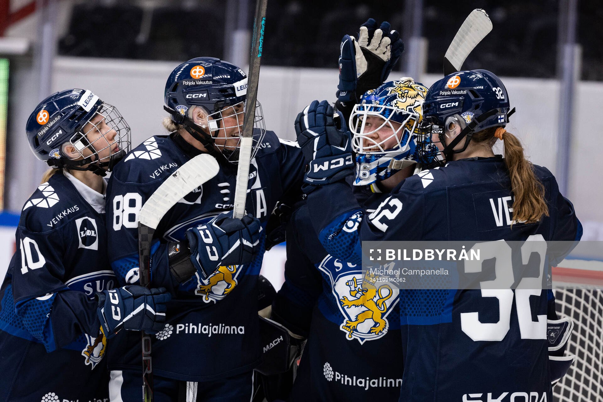 Ronja Savolainen, goaltender Anni Keisala, and Emilia Vesa