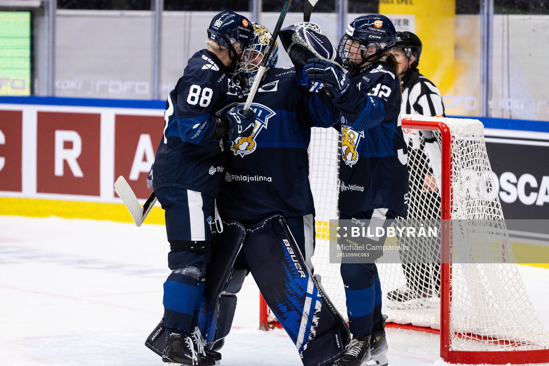 Ronja Savolainen, goaltender Anni Keisala, and Emilia Vesa