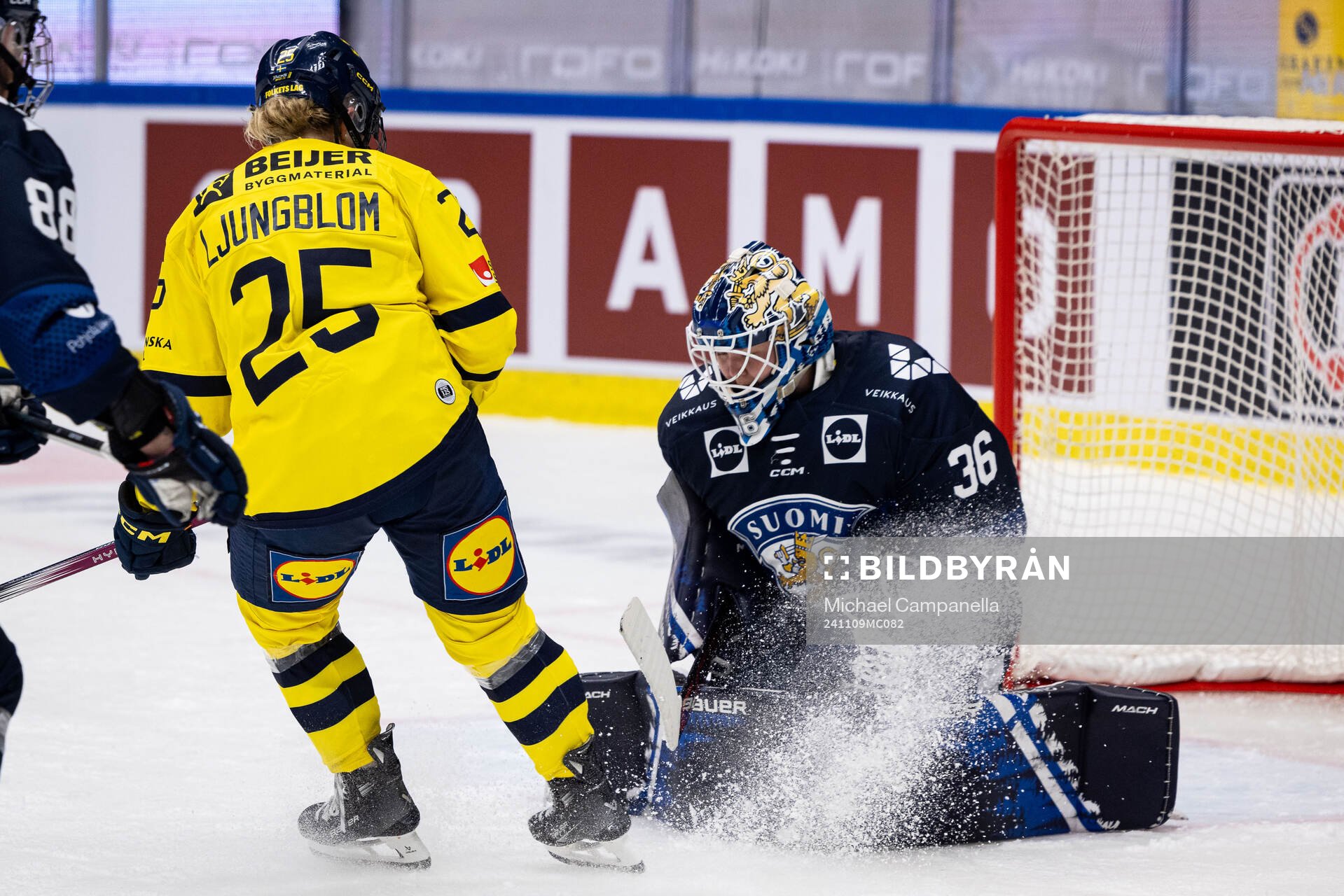 Lina Ljungblom of Sweden and goaltender Anni Keisala of