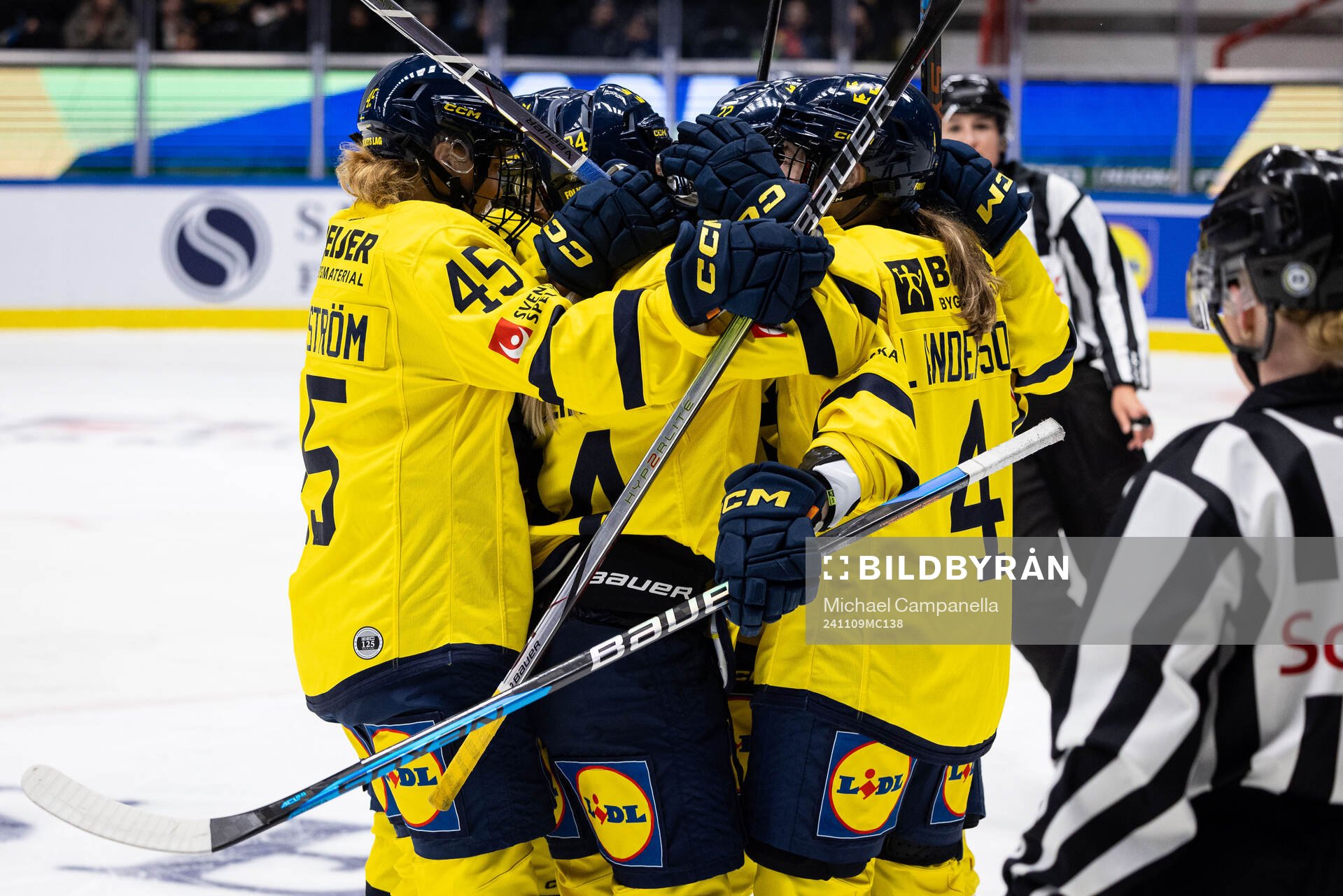 Players from Sweden embrace