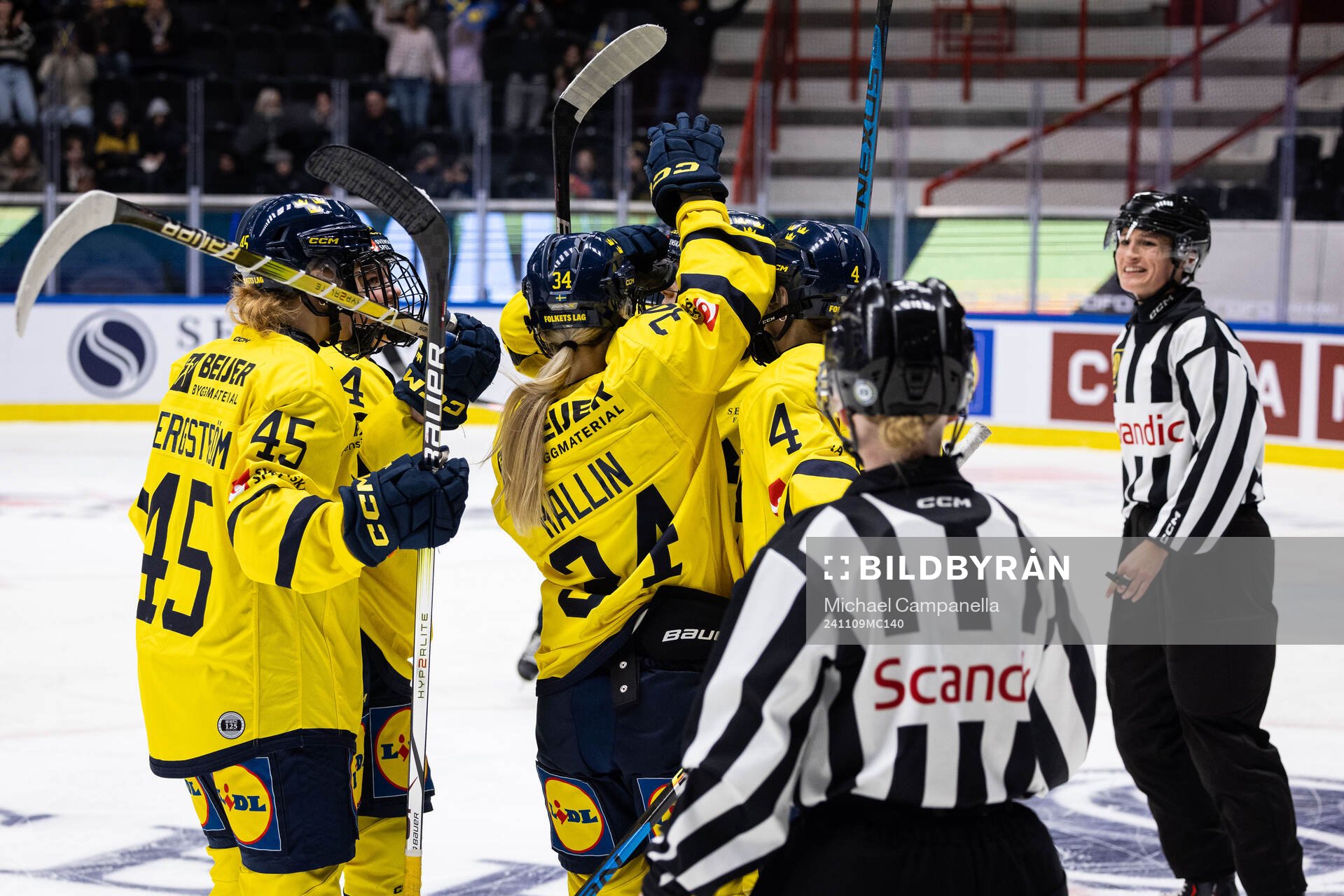 Players from Sweden embrace