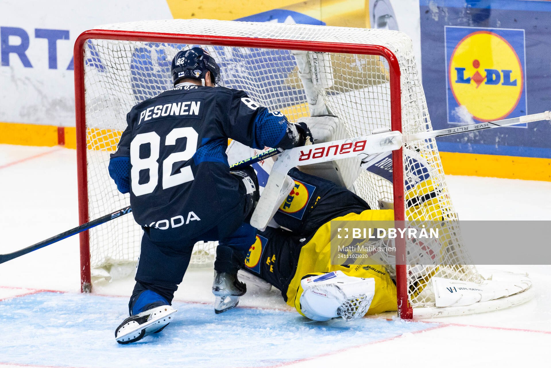 Harri Pesonen of Finland and goalkeeper Jacob Johansson of