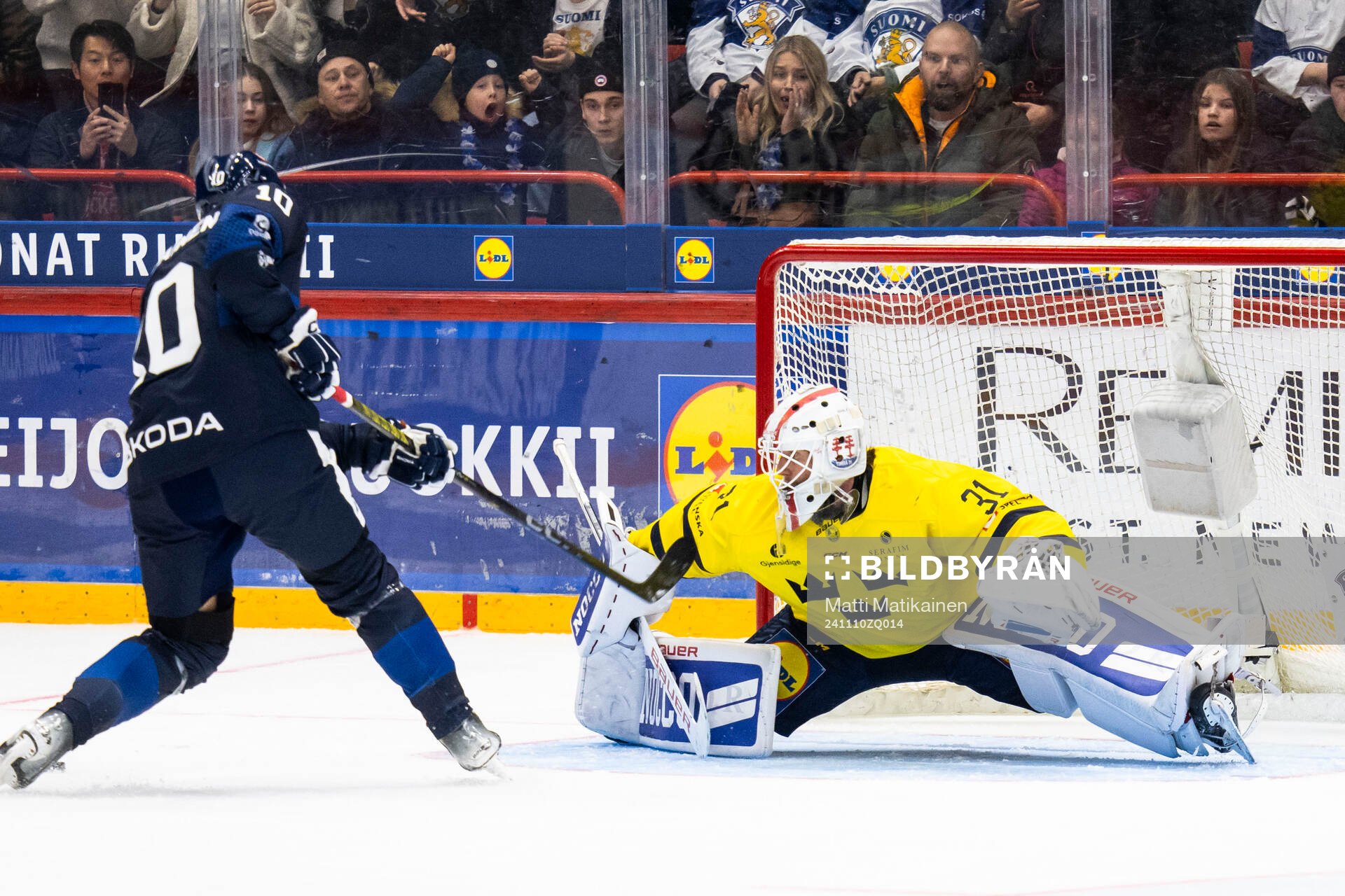 Kristian Vesalainen of Finland and goalkeeper Jacob