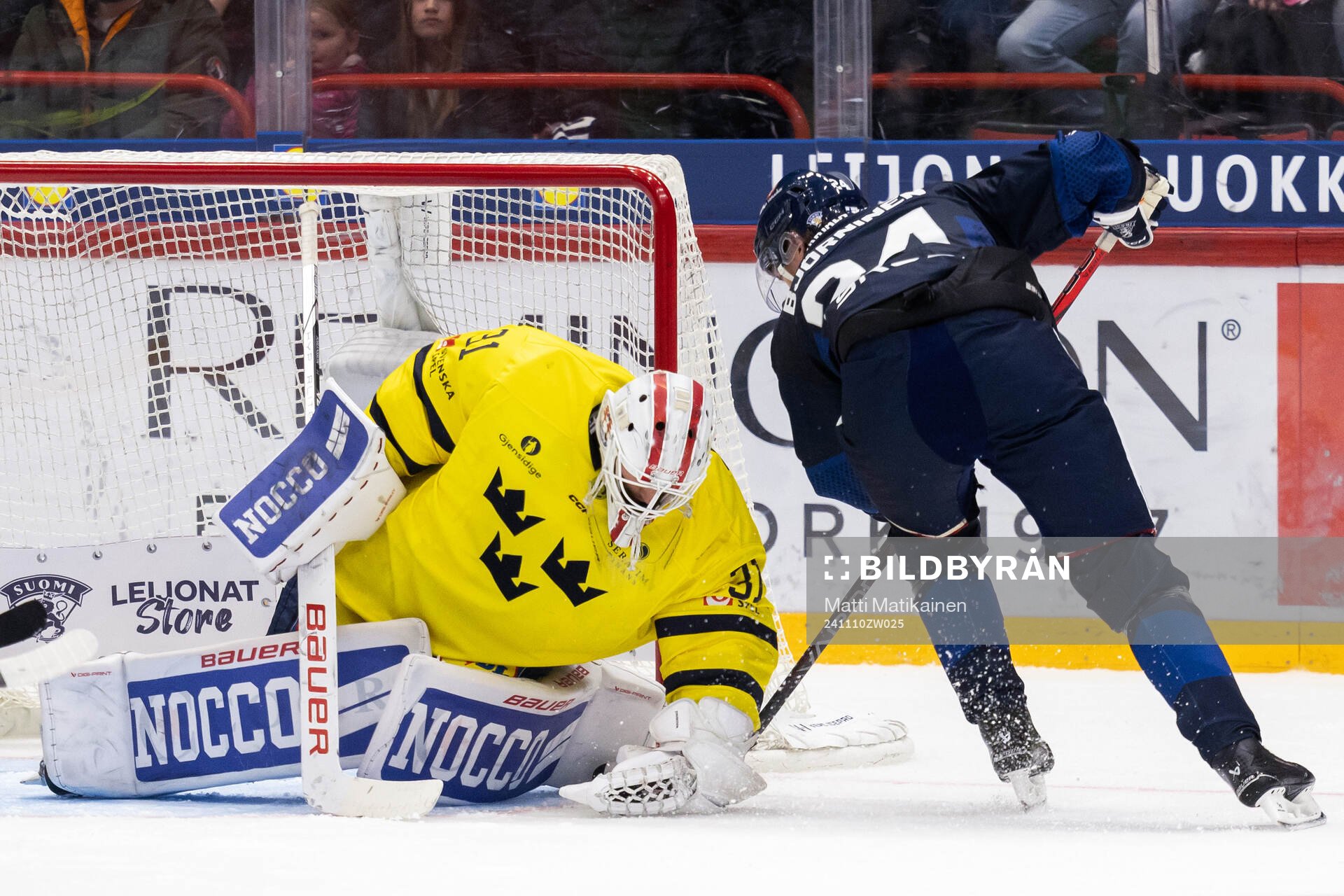 Goalkeeper Jacob Johansson of Sweden and Hannes Björninen