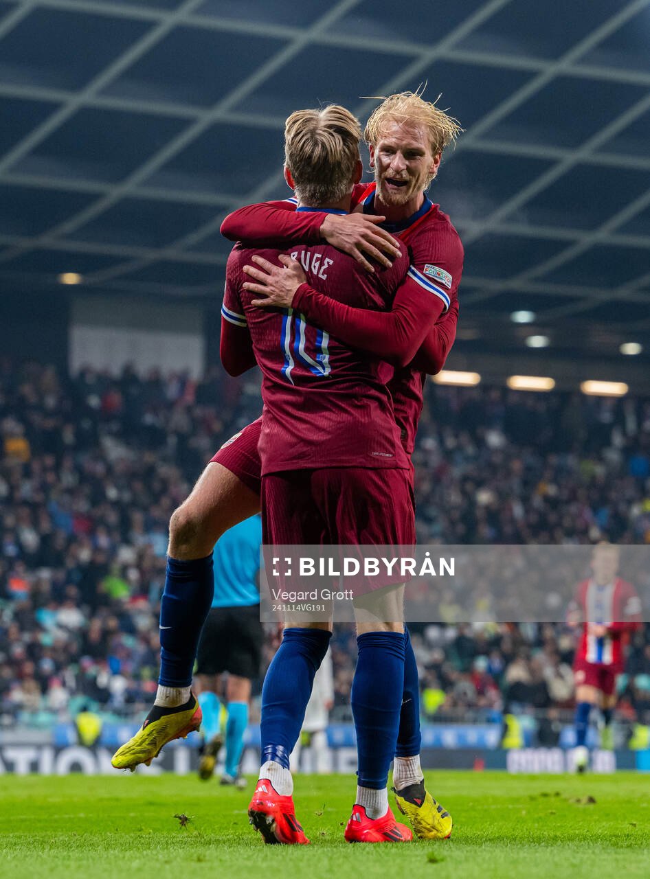Jens Petter Hauge of Norway celebrates with teammate Morten Thorsby after scoring 1-4 during the Nations League football match between Slovenia and Norway on November 14, 2024 in Ljubljana.