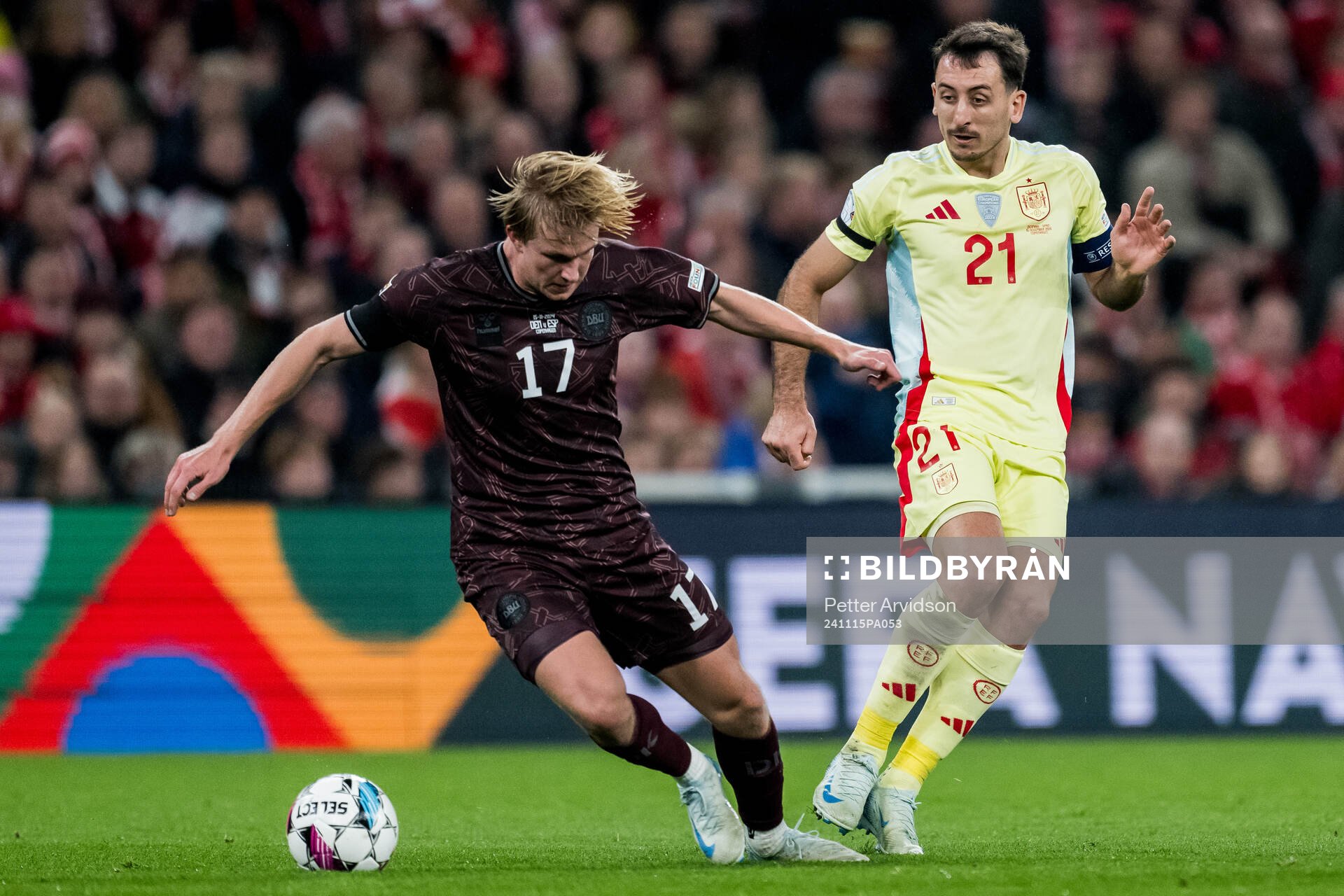 Victor Kristiansen of Denmark and Mikel Oyarzabal of Spain