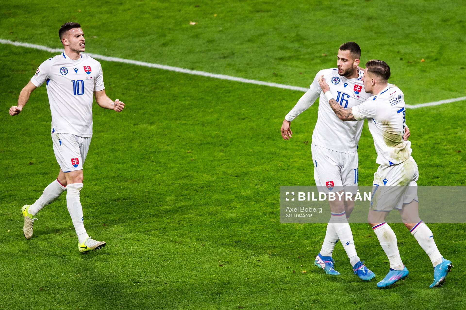 David Hancko and Tomas Suslov of Slovakia celebrate 1-1