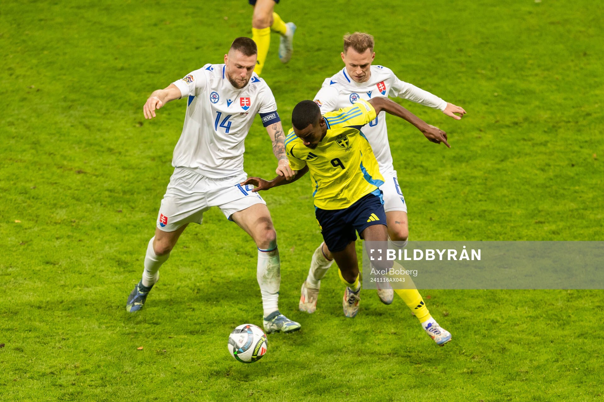 Milan Skriniar of Slovakia and Alexander Isak of Sweden