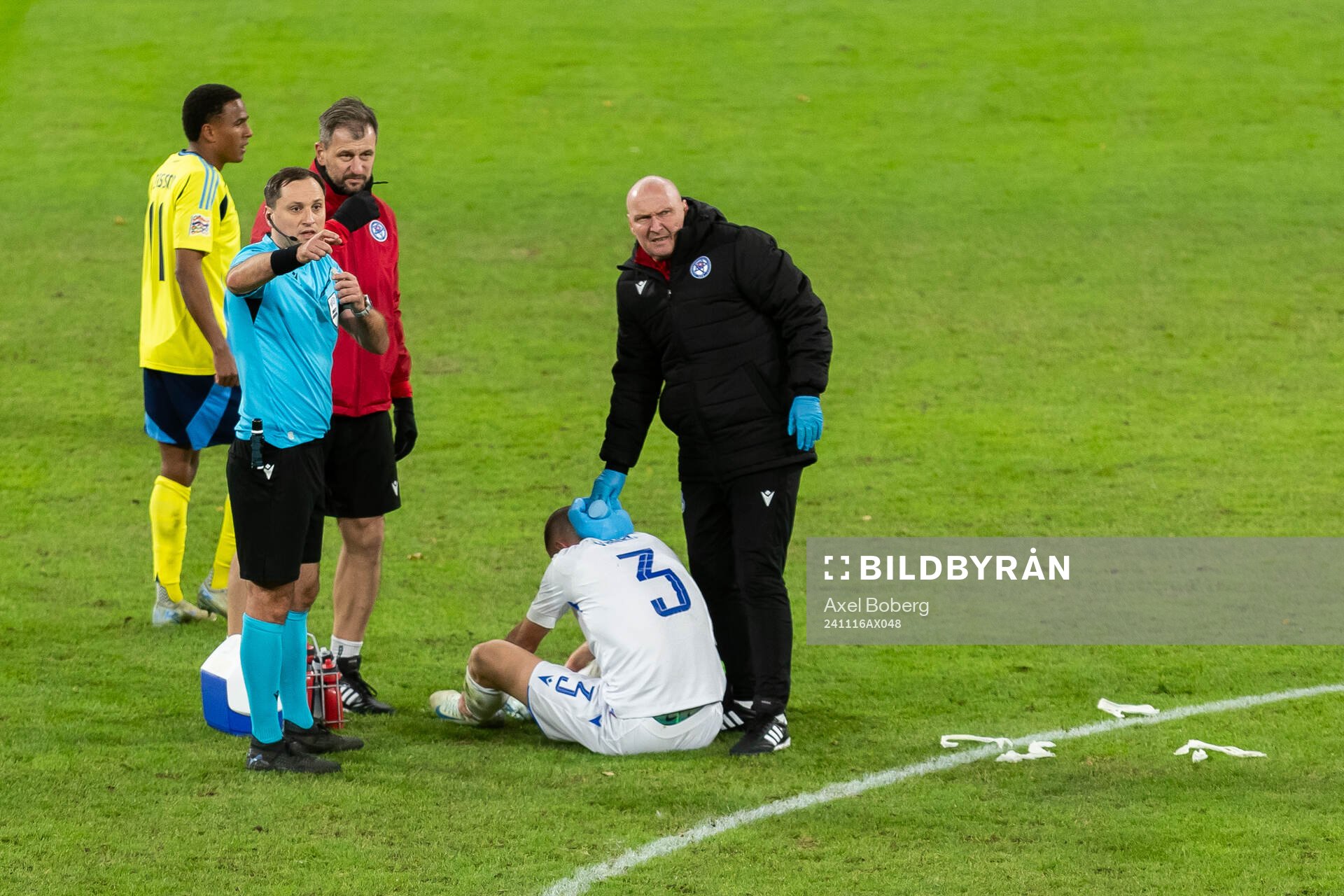Denis Vavro of Slovakia receives medical care