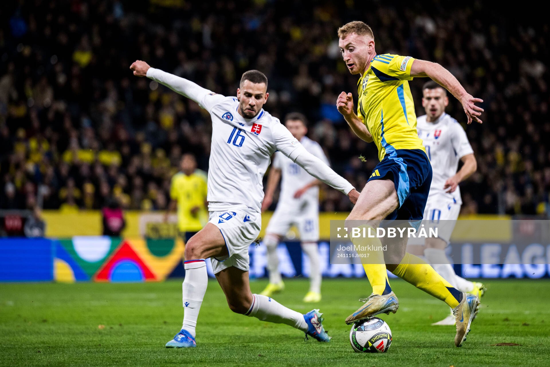 David Hancko of Slovakia and Dejan Kulusevski of Sweden