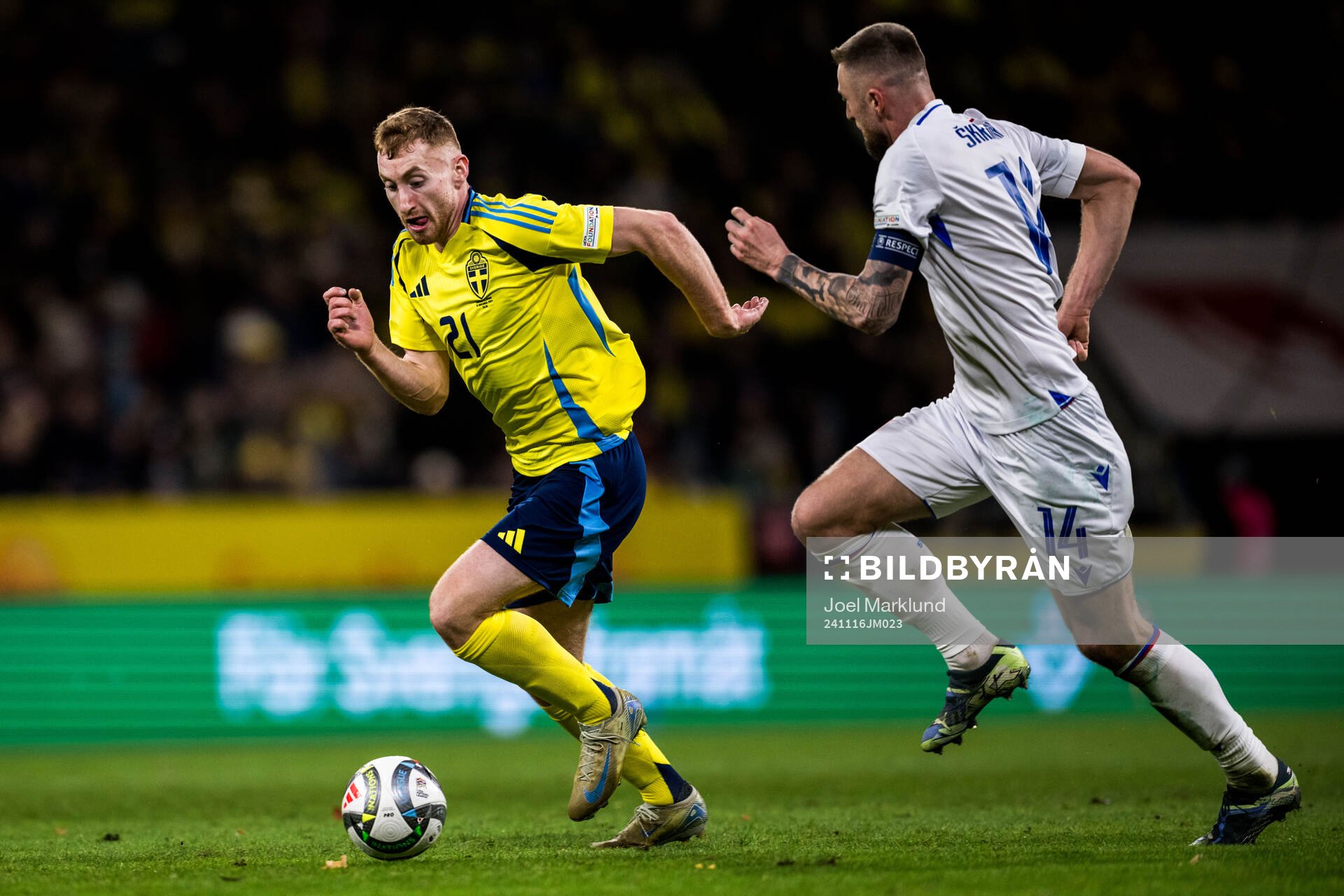 Dejan Kulusevski of Sweden and Milan Skriniar of Slovakia