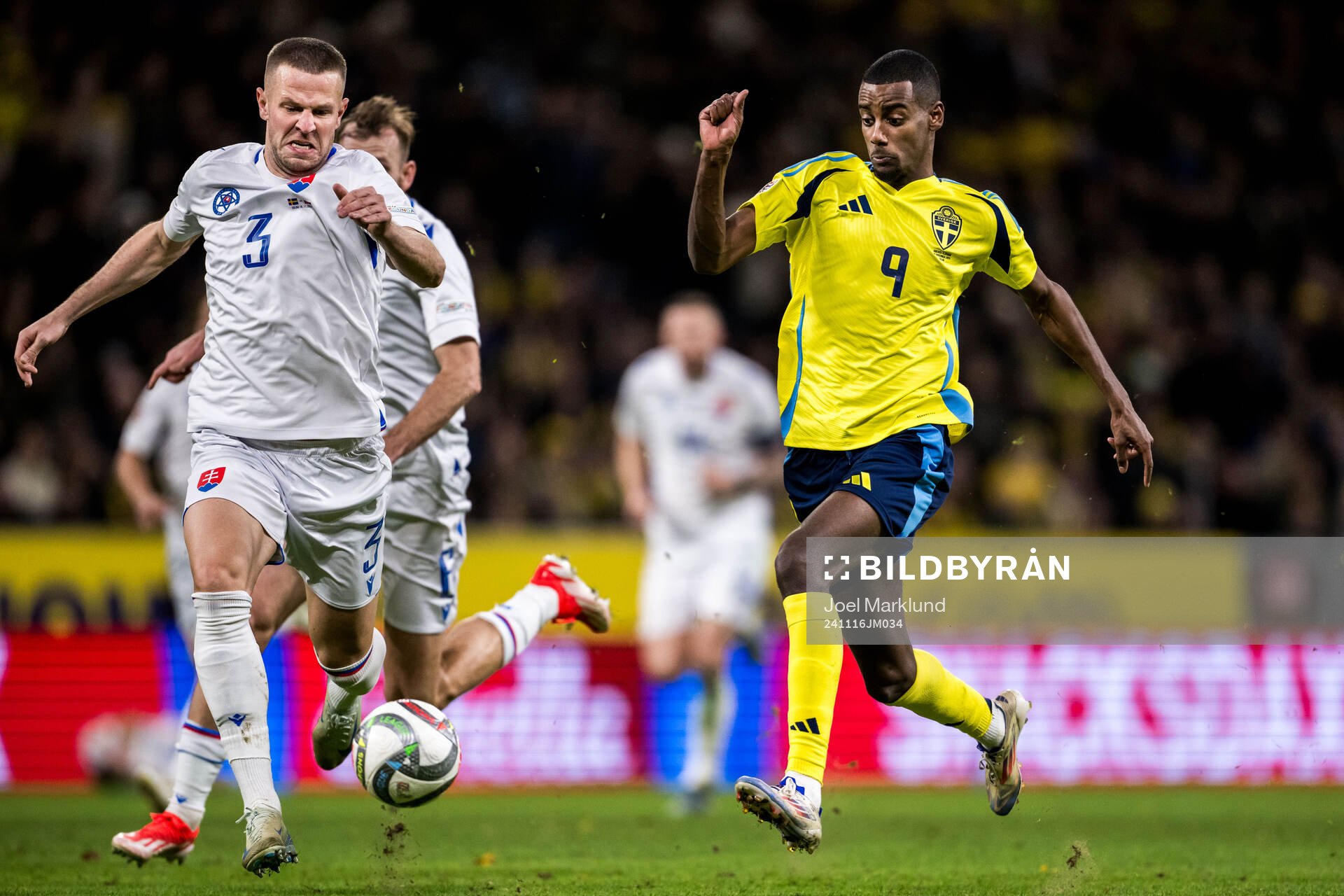 Denis Vavro of Slovakia and Alexander Isak of Sweden