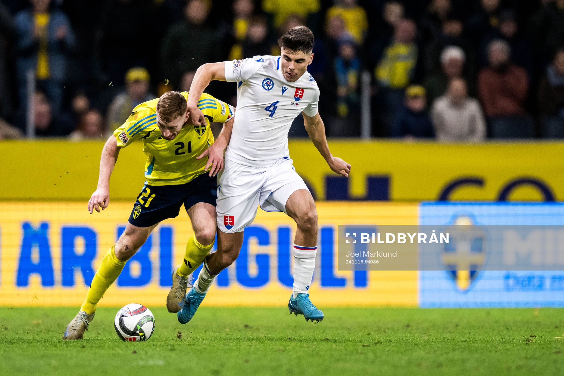 Dejan Kulusevski of Sweden and Adam Obert of Slovakia
