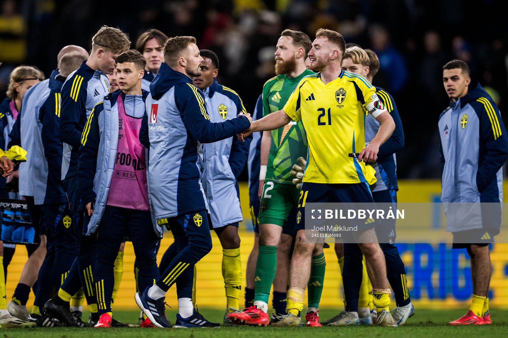 Assistant coach Sebastian Larsson and Dejan Kulusevski of