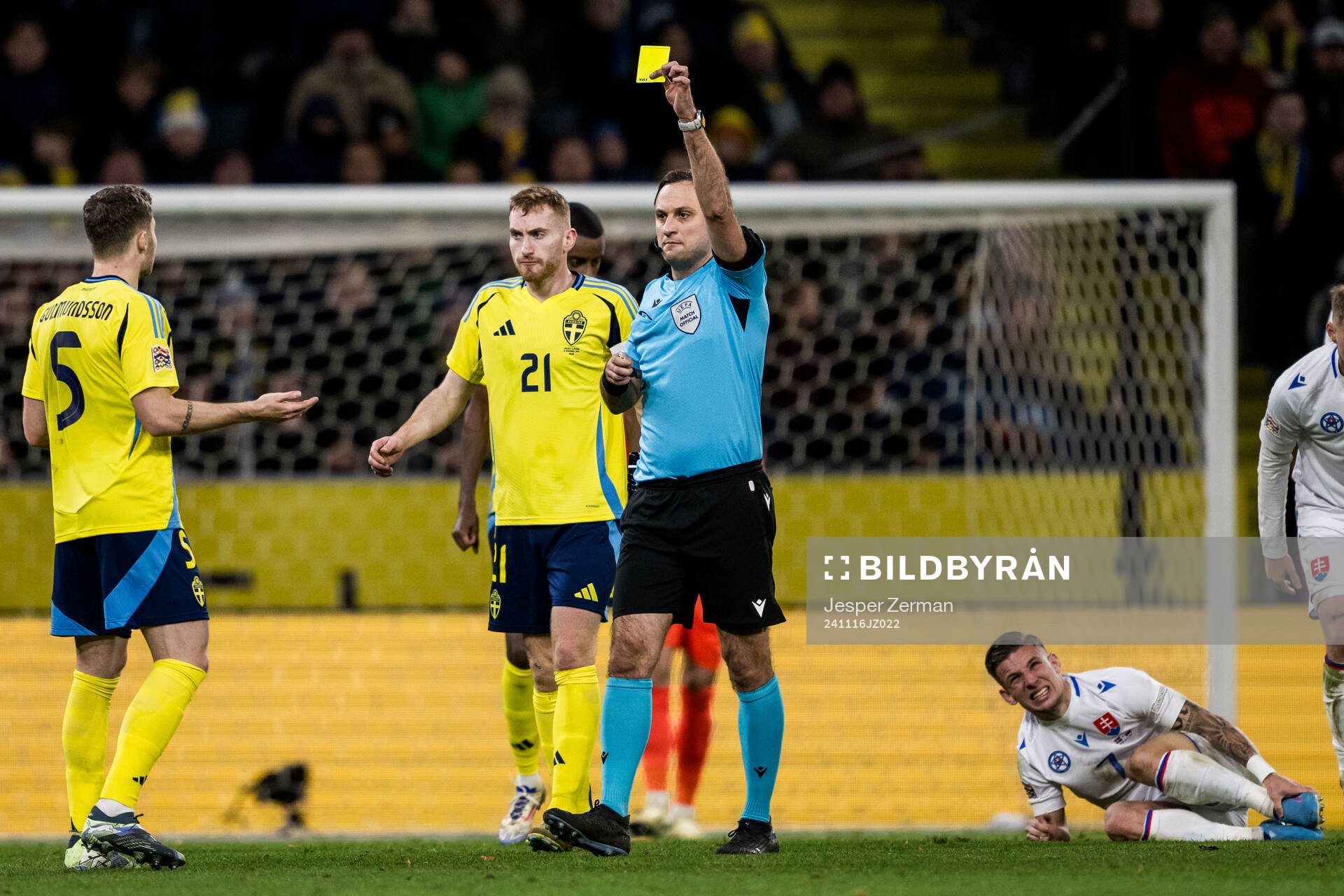 Gabriel Gudmundsson of Sweden receives a yellow card