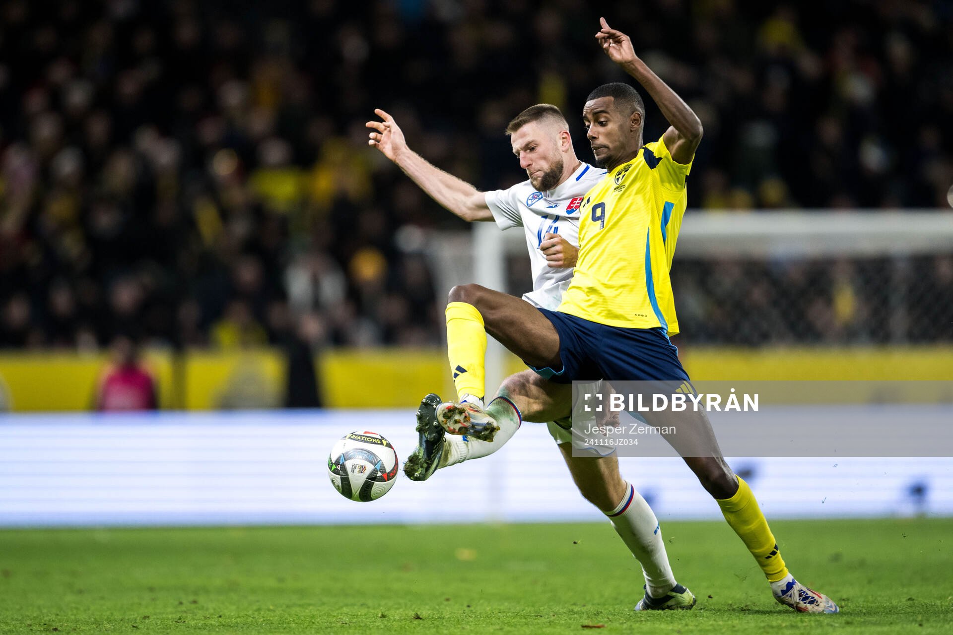 Milan Skriniar of Slovakia and Alexander Isak of Sweden
