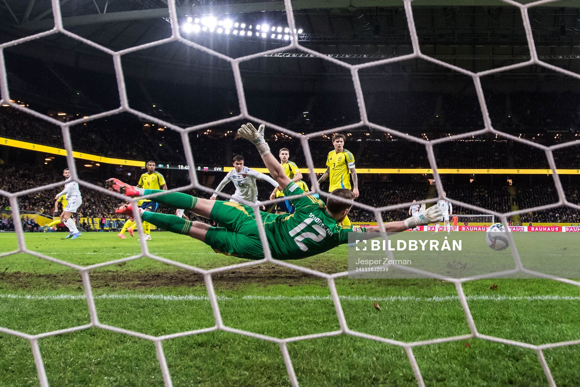 David Hancko of Slovakia (not in picture) scores 1-1 behind