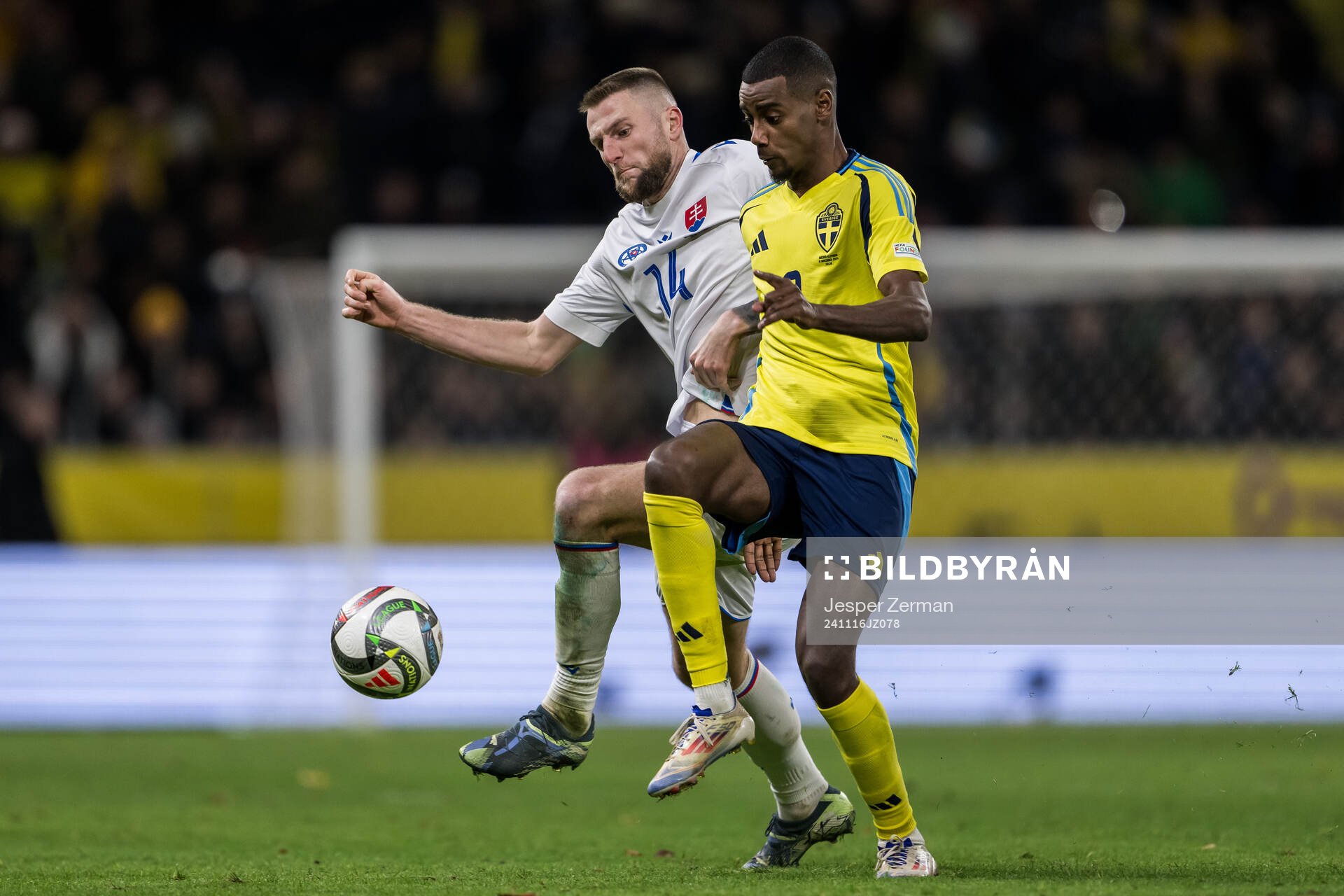 Milan Skriniar of Slovakia and Alexander Isak of Sweden