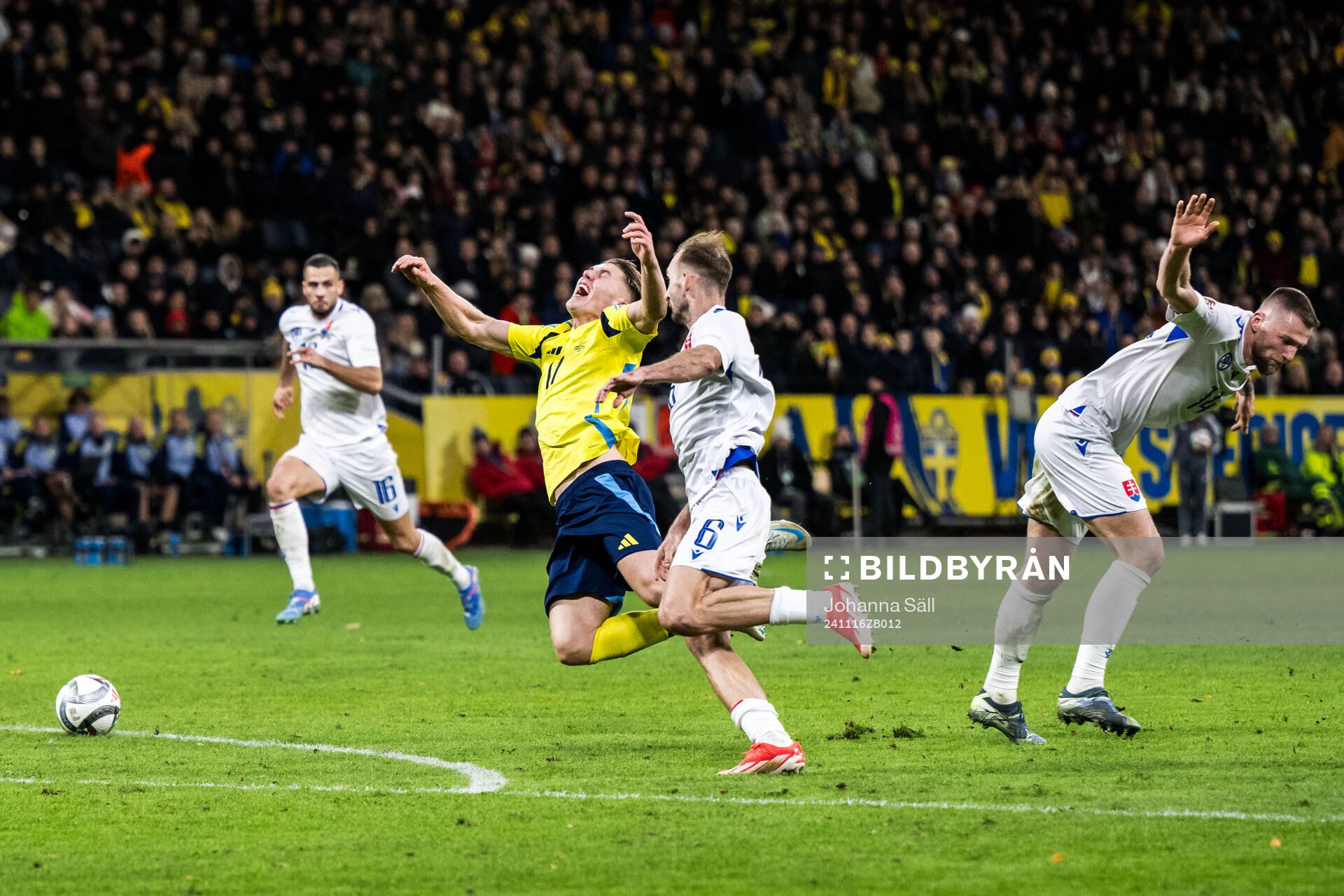 Norbert Gyömber and Milan Skriniar of Slovakia and Viktor