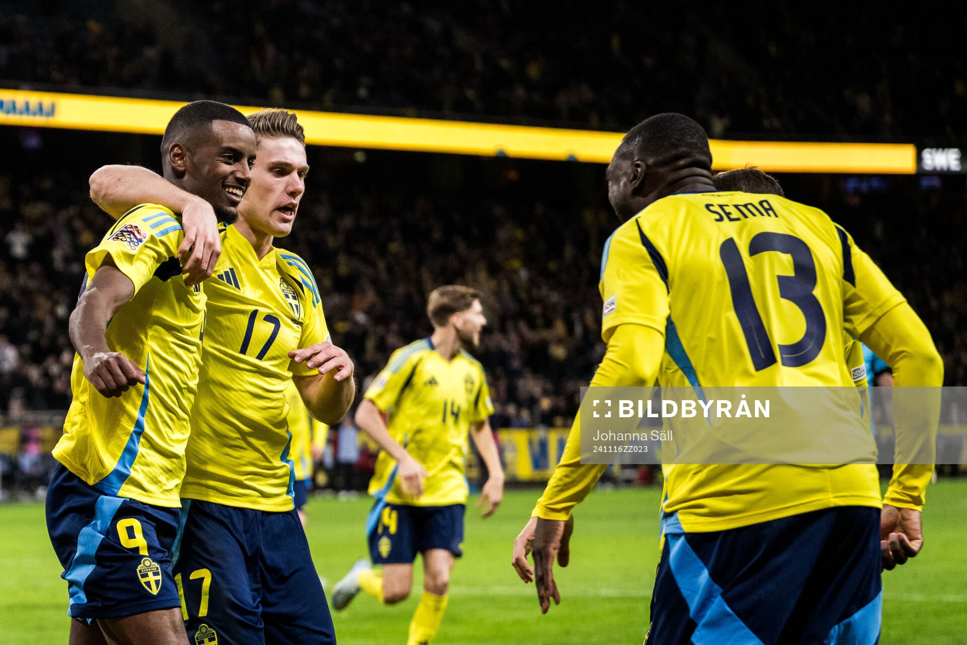 Alexander Isak and Viktor Gyökeres of Sweden celebrate 2-1