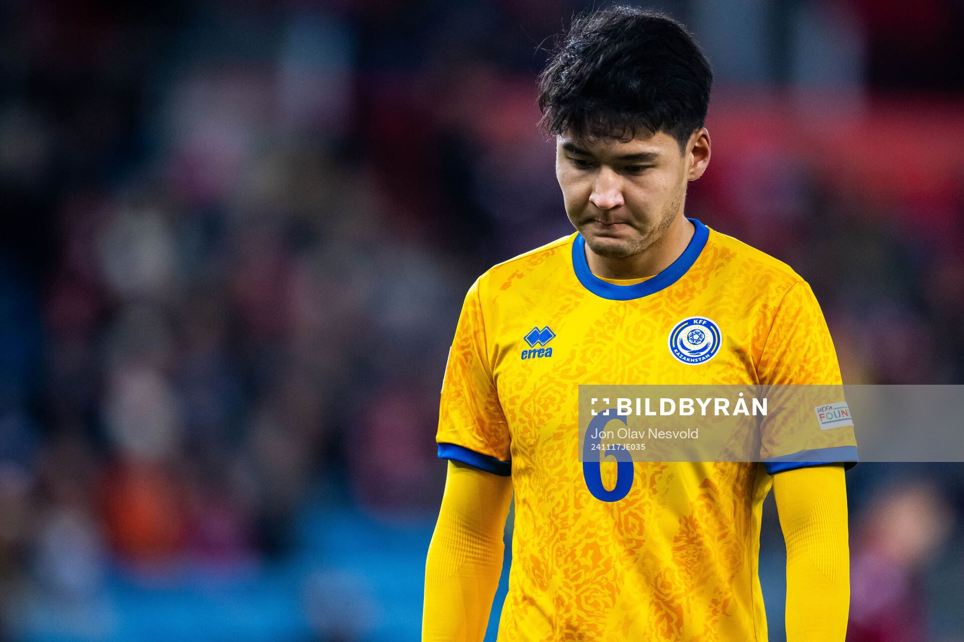 Alibek Kassym of Kazakhstan looks dejected
