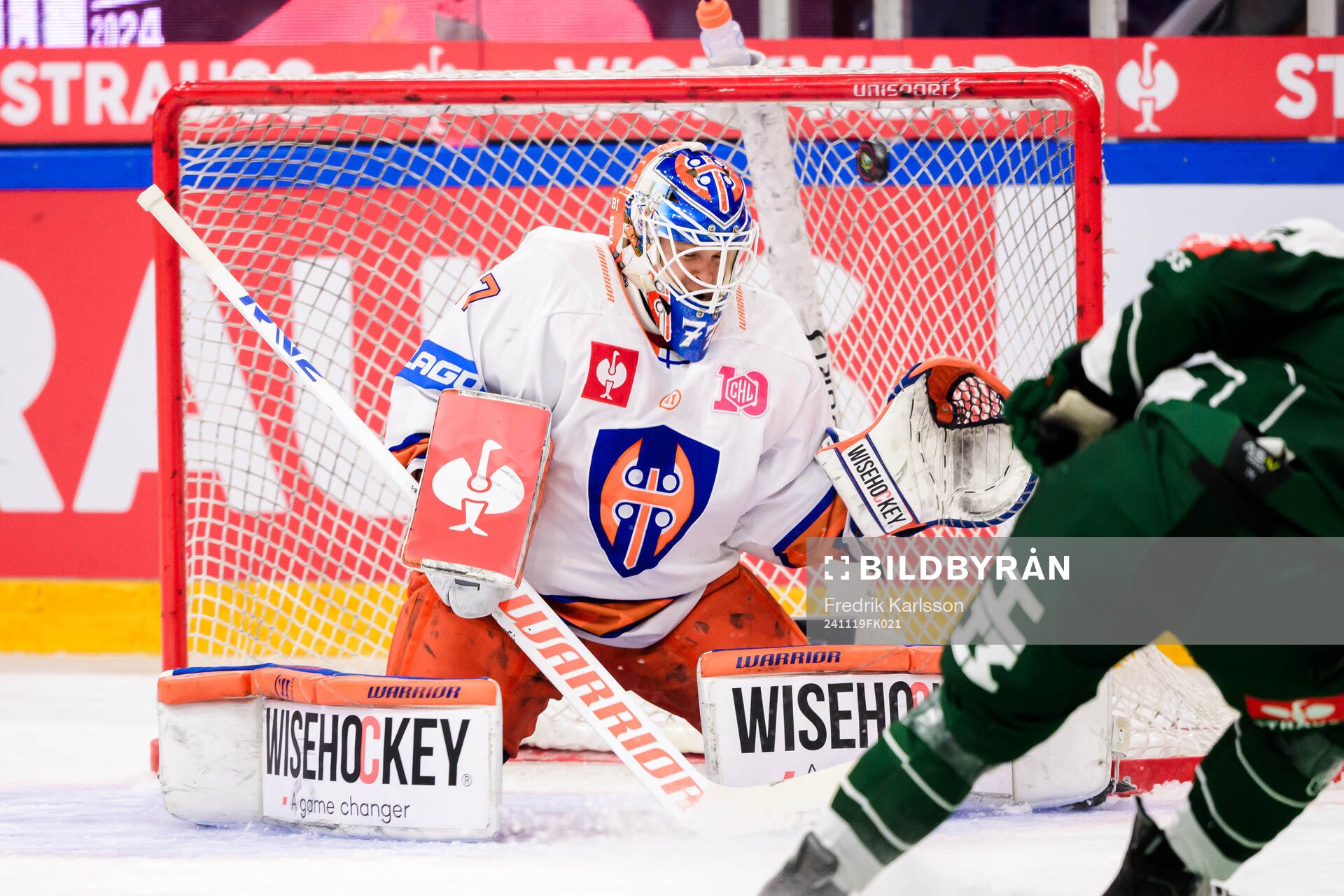 goaltender Juha Metsola and Henrik Björklund of Färjestad