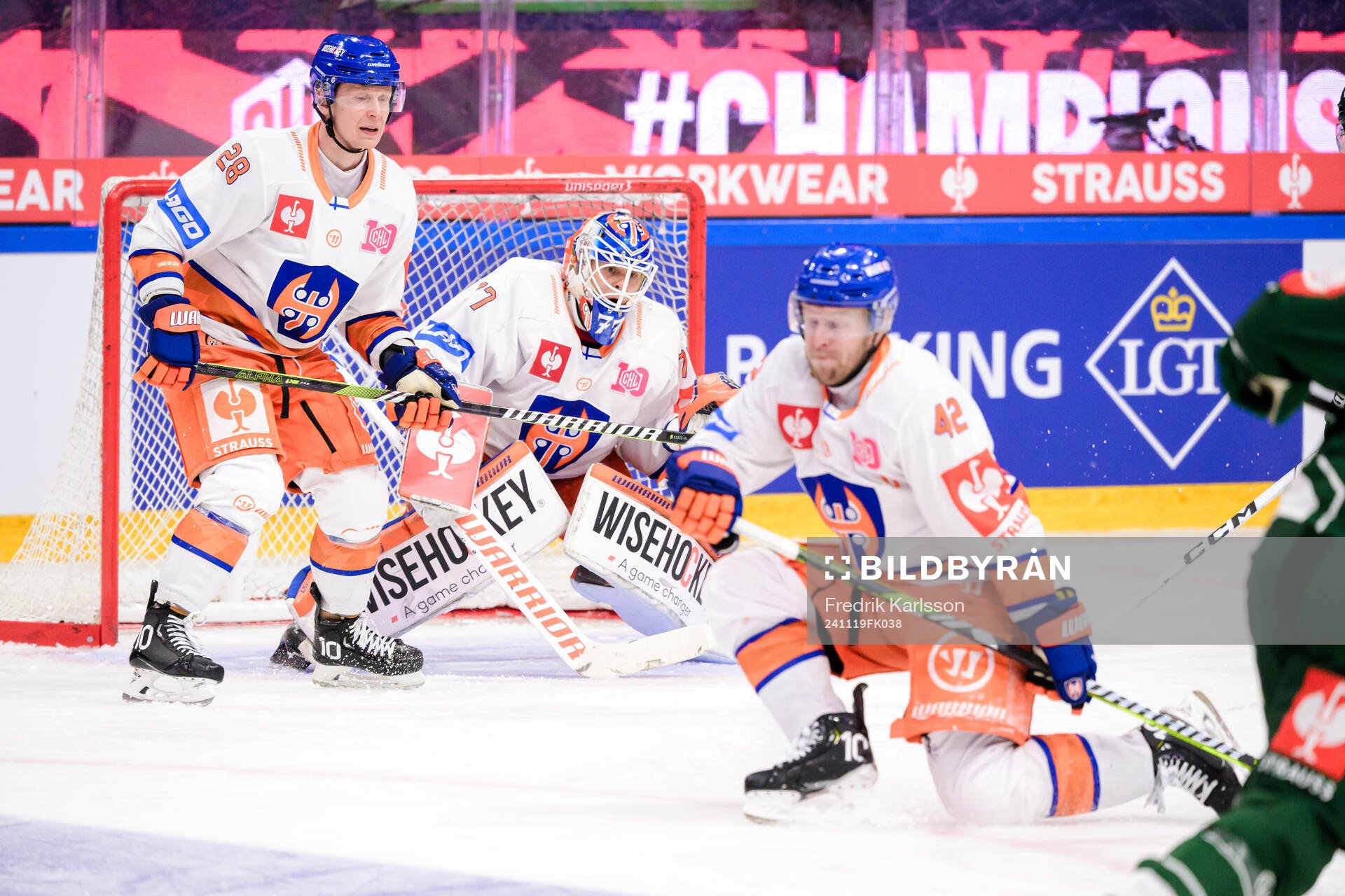Otto Leskinen and goaltender Juha Metsola of Tappara Tampere