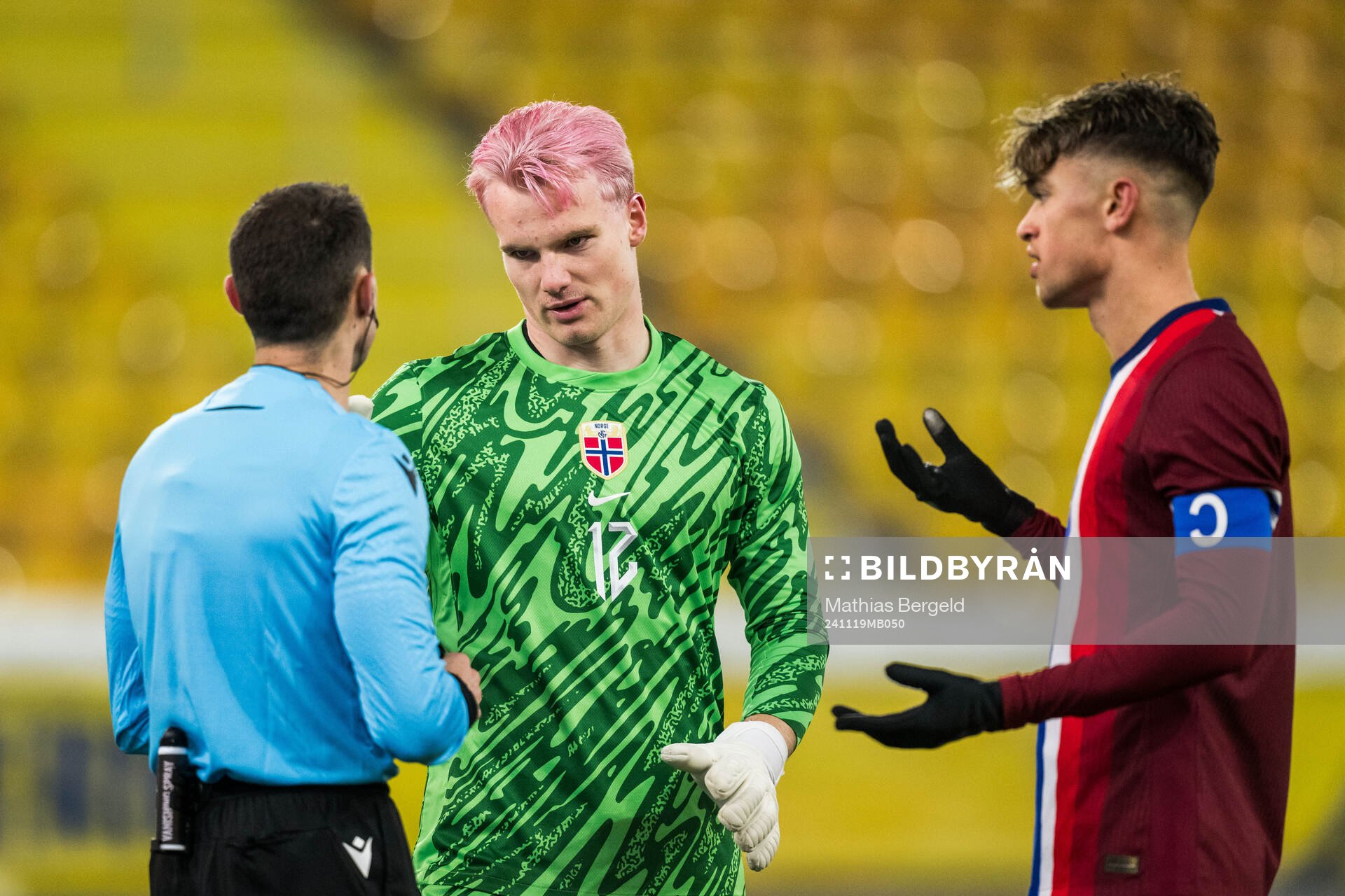Referee David Fuxman and Goalkeeper Magnus Stær-Jensen and