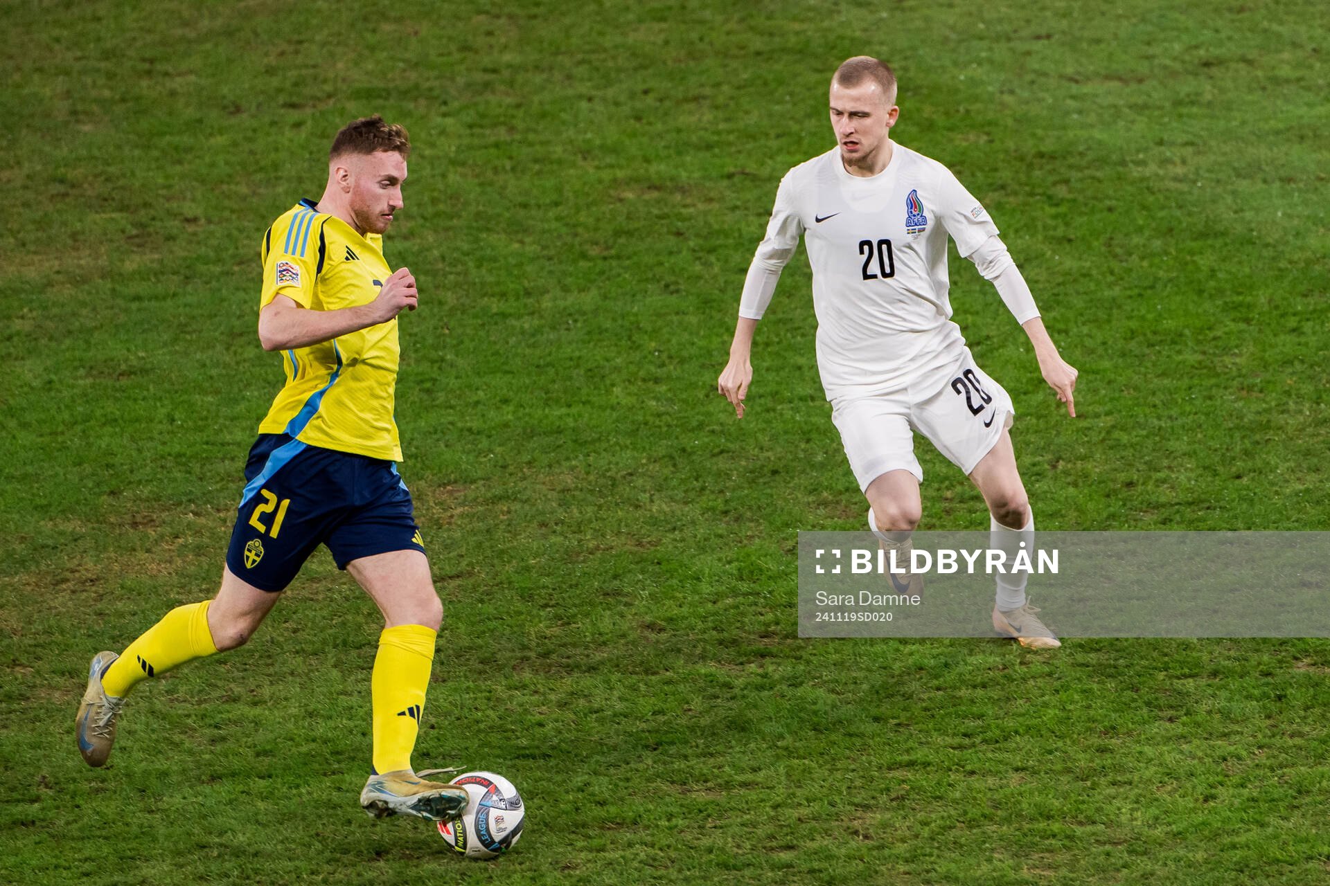 Dejan Kulusevski of Sweden and Rustam Akmedzade of