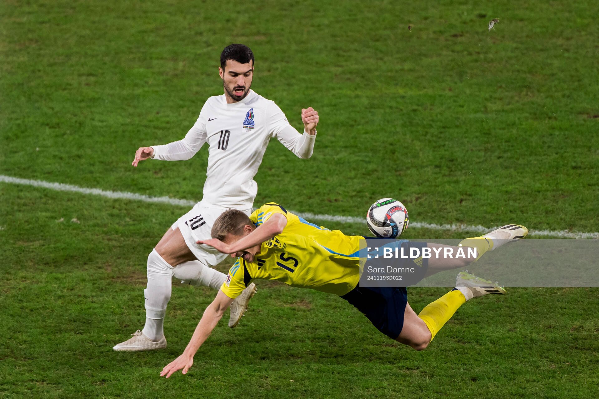 Aleksey Isaev of Azerbaijan and Carl Starfelt of Sweden during the Nations League football match between Sweden and Azerbaijan on November 19, 2024 in Stockholm.