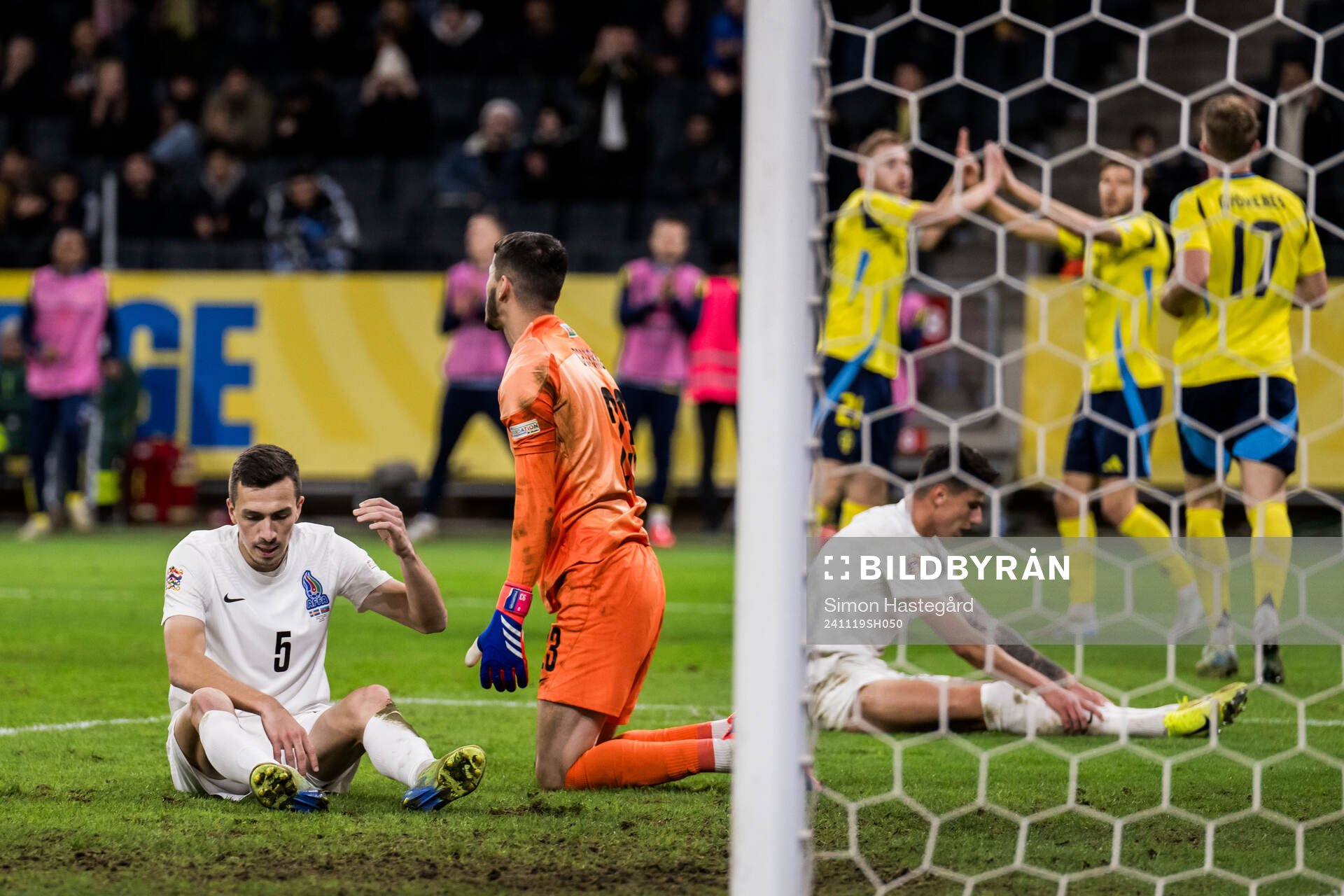 Joshgun Diniyev and goalkeeper Elvin Jafarguliyev of