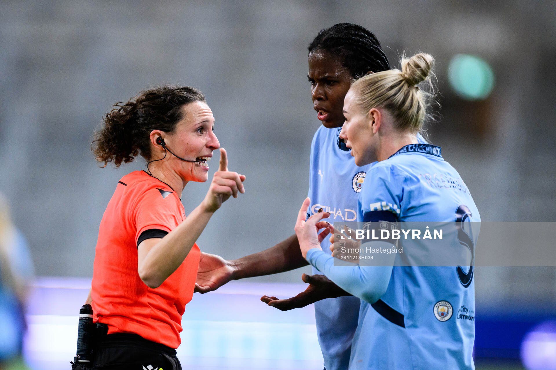 Referee Silvia Gasperotti and Alex Greenwood and Khadija