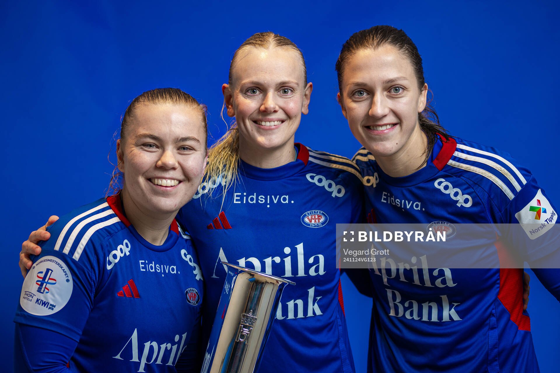 Olaug Tvedten, Karina Sævik and Emma Stølen Godø of Vålerenga pose for a portrait with the trophy after winning the women’s football cup final match between Rosenborg and Vålerenga on November 24, 2024 in Oslo.