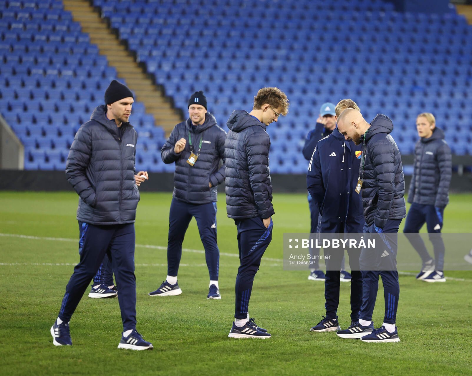 Players of Djurgården inspect the pitch