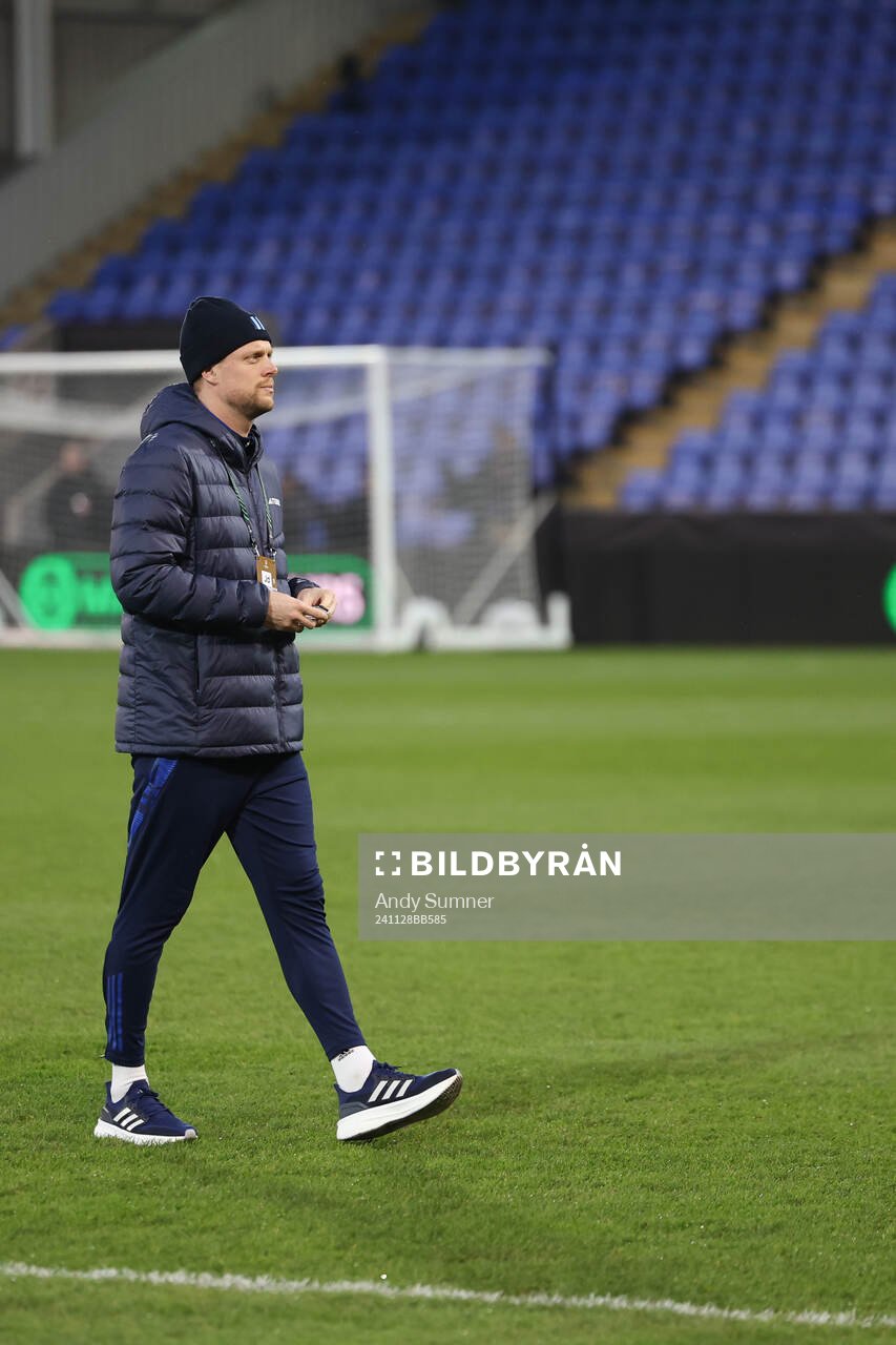 Players of Djurgården inspect the pitch