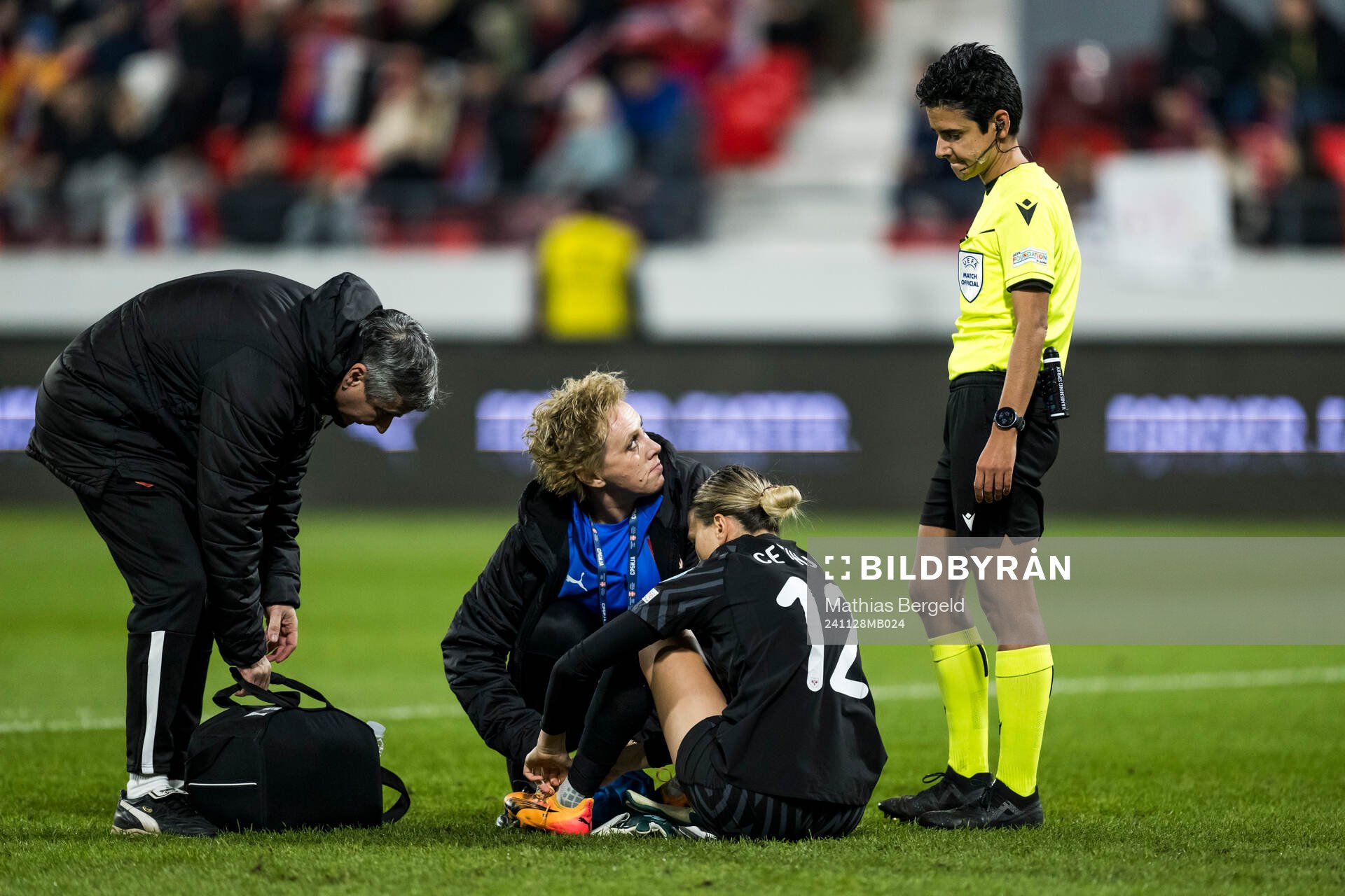 Goalkeeper Sara Cetinja of Serbia and referee Catarina