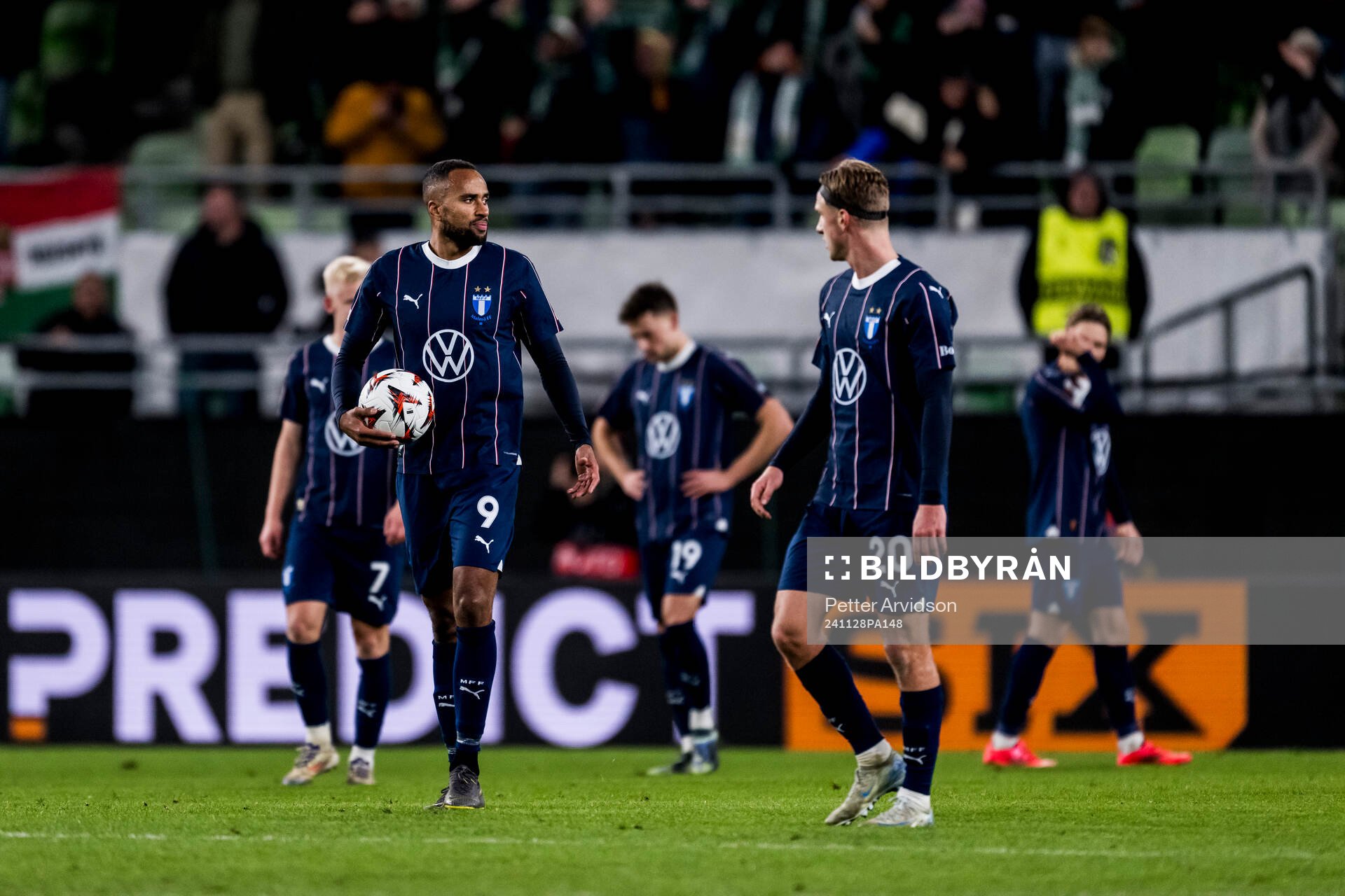 Isaac Kiese Thelin and Niklas Moisander of Malmö FF looks