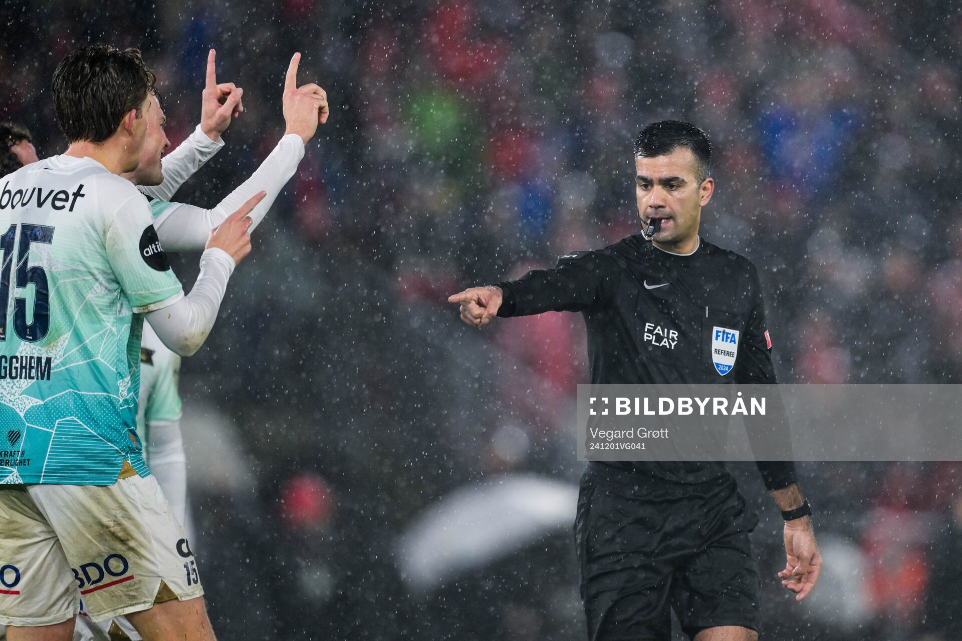 Referee Rohit Saggi gives a penalty